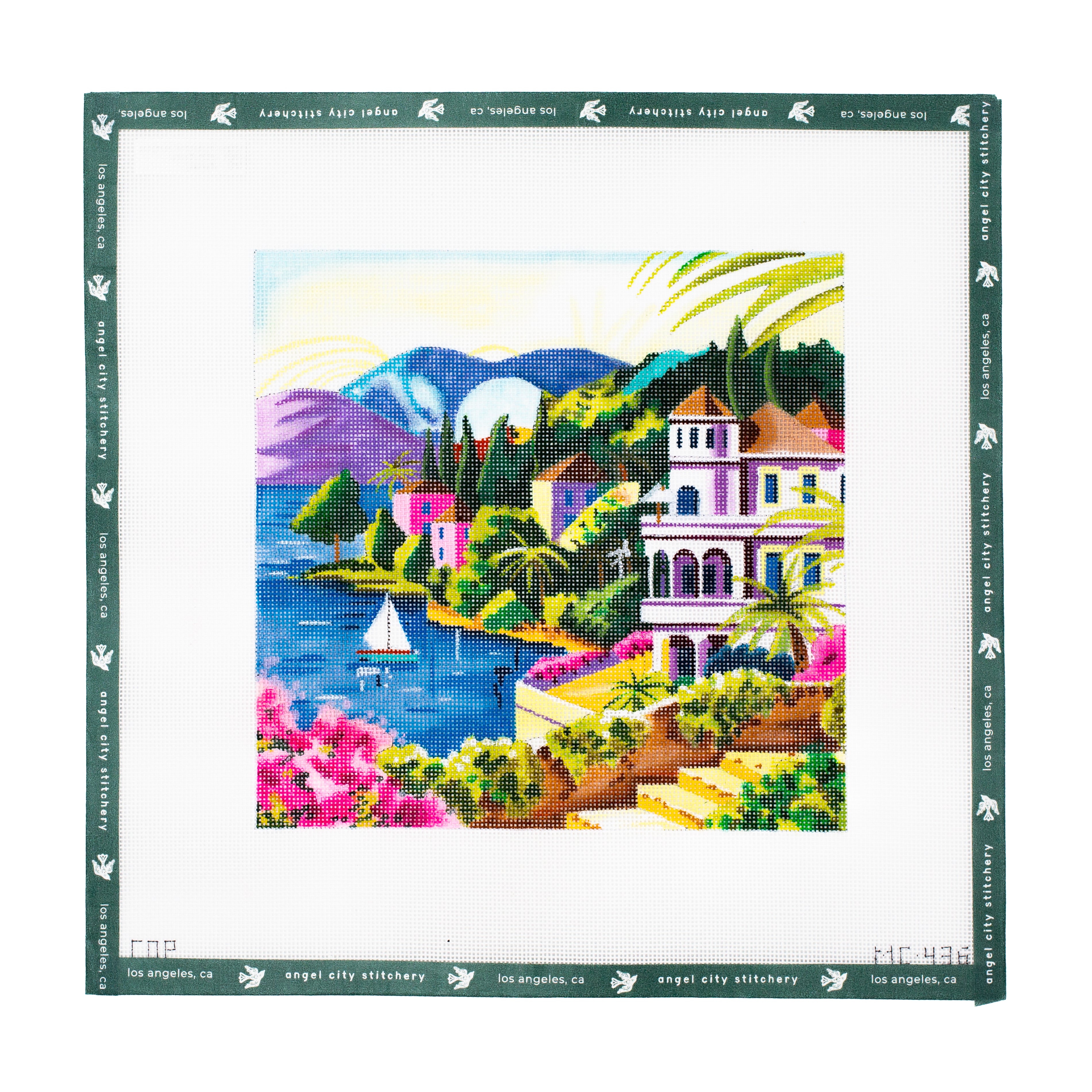 Embroidery canvas pattern with a colorful coastal scene featuring houses and a sailboat.