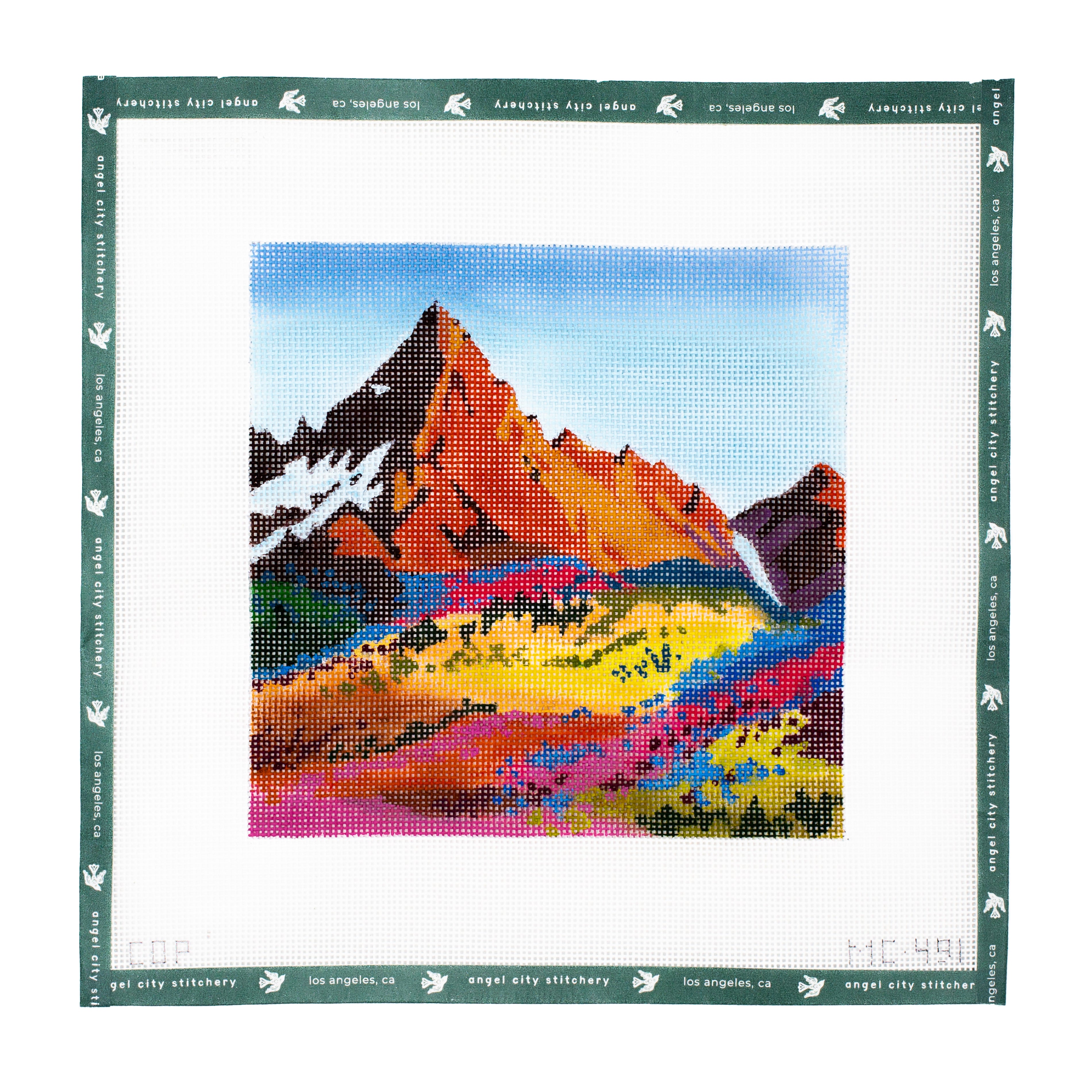 Embroidery canvas of a Colorful mountain landscape cross-stitch pattern with 'Angel City Stitchery' branding.