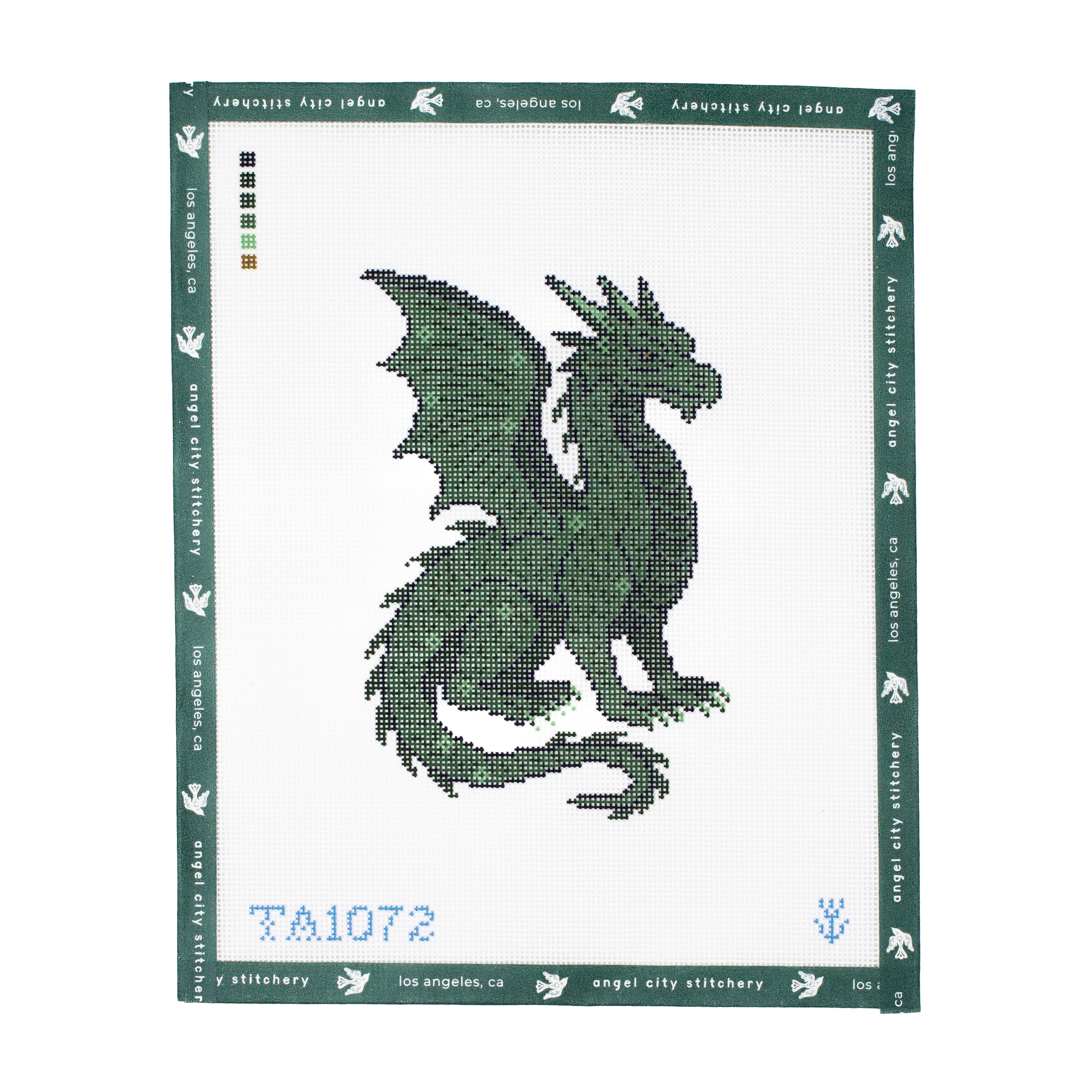 Embroidery canvas pattern with a green dragon design on a white background, featuring Angel City Stitchery branding.