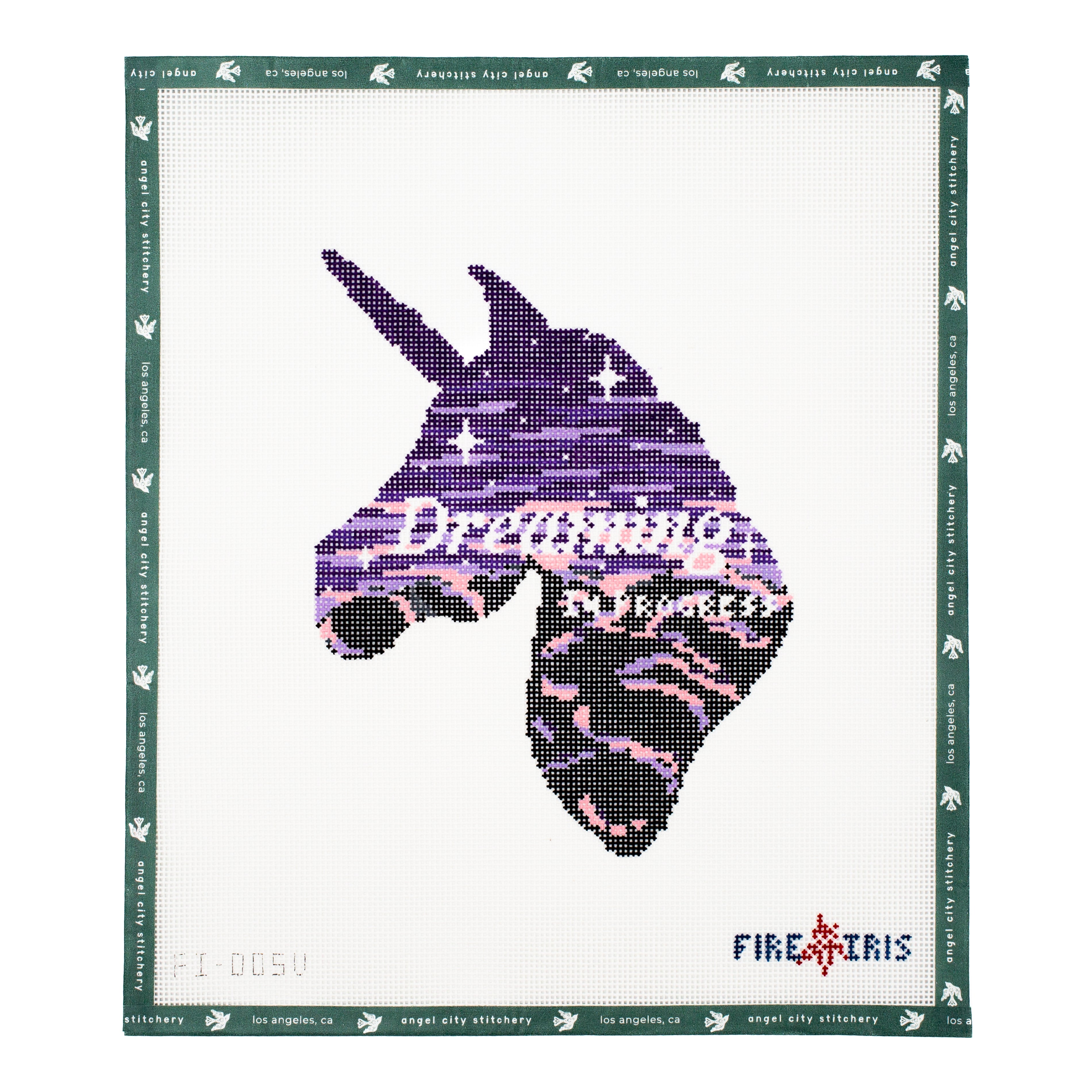Needlepoint canvas pattern of a unicorn head with 'Dreaming' text on a white background, framed by green border.