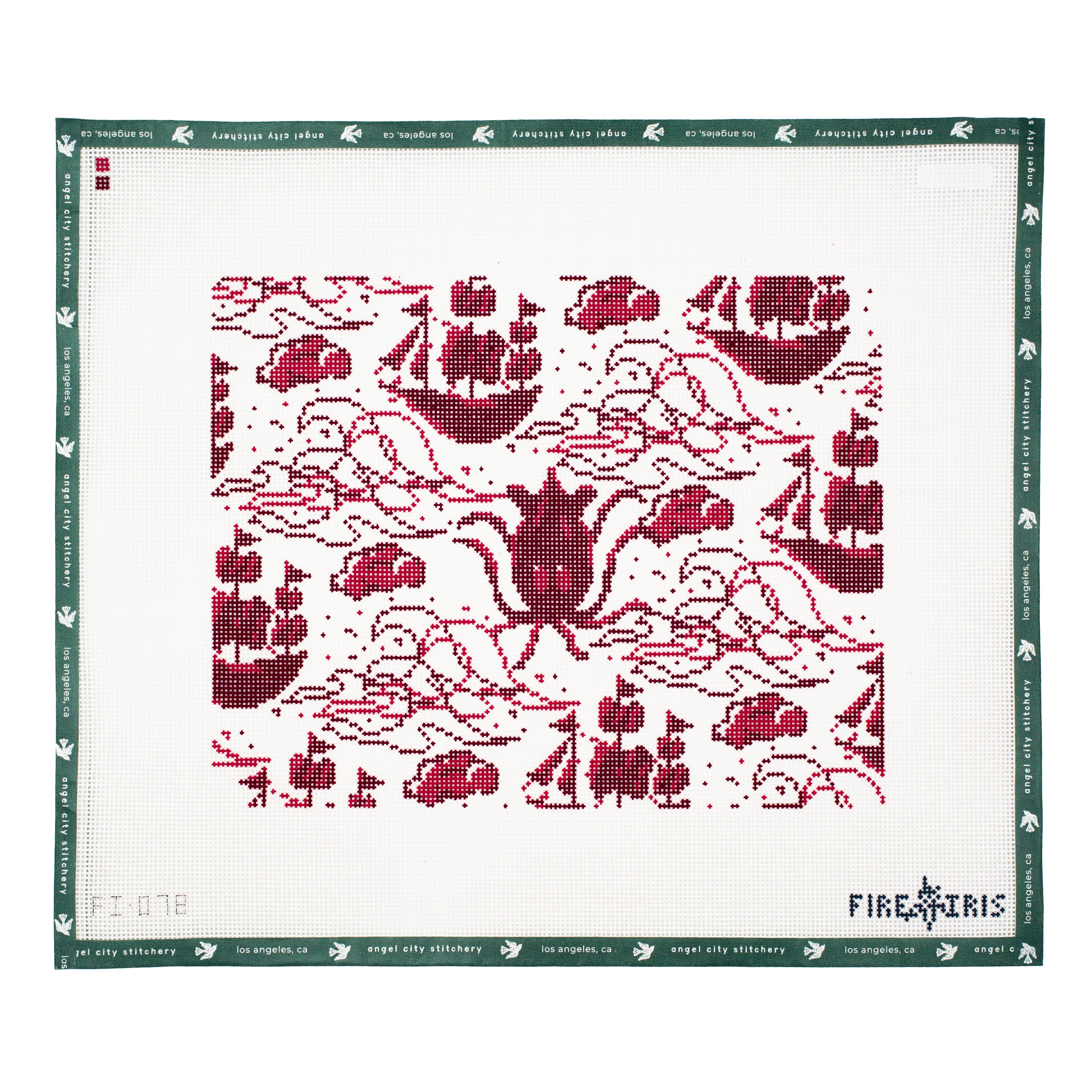 Needlepoint canvas pattern with red boat design on a white fabric, featuring the brand 'Fire & Iris'.