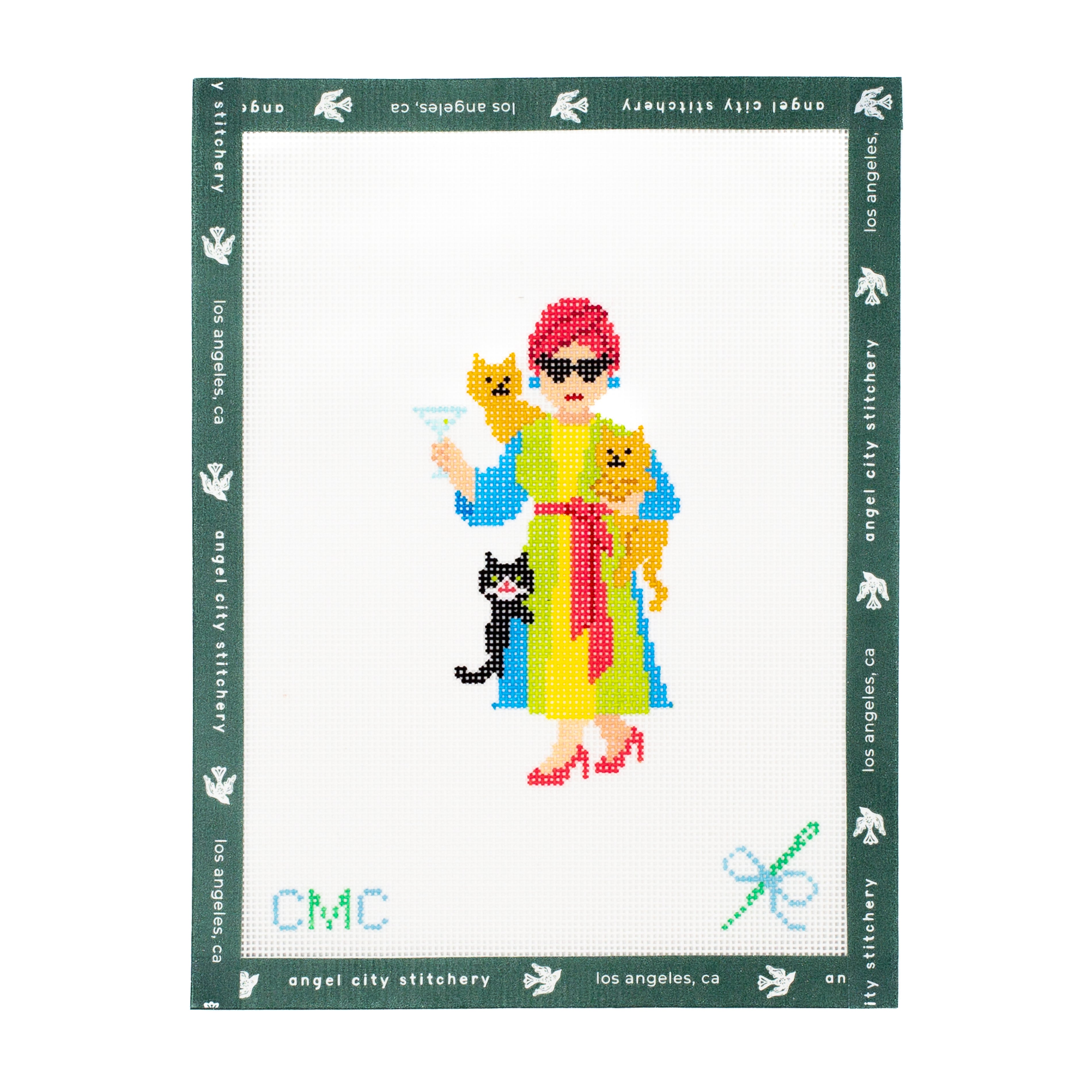 Cross-stitch Embroidery canvas character holding cats, framed by 'angel city embroidery' branding.