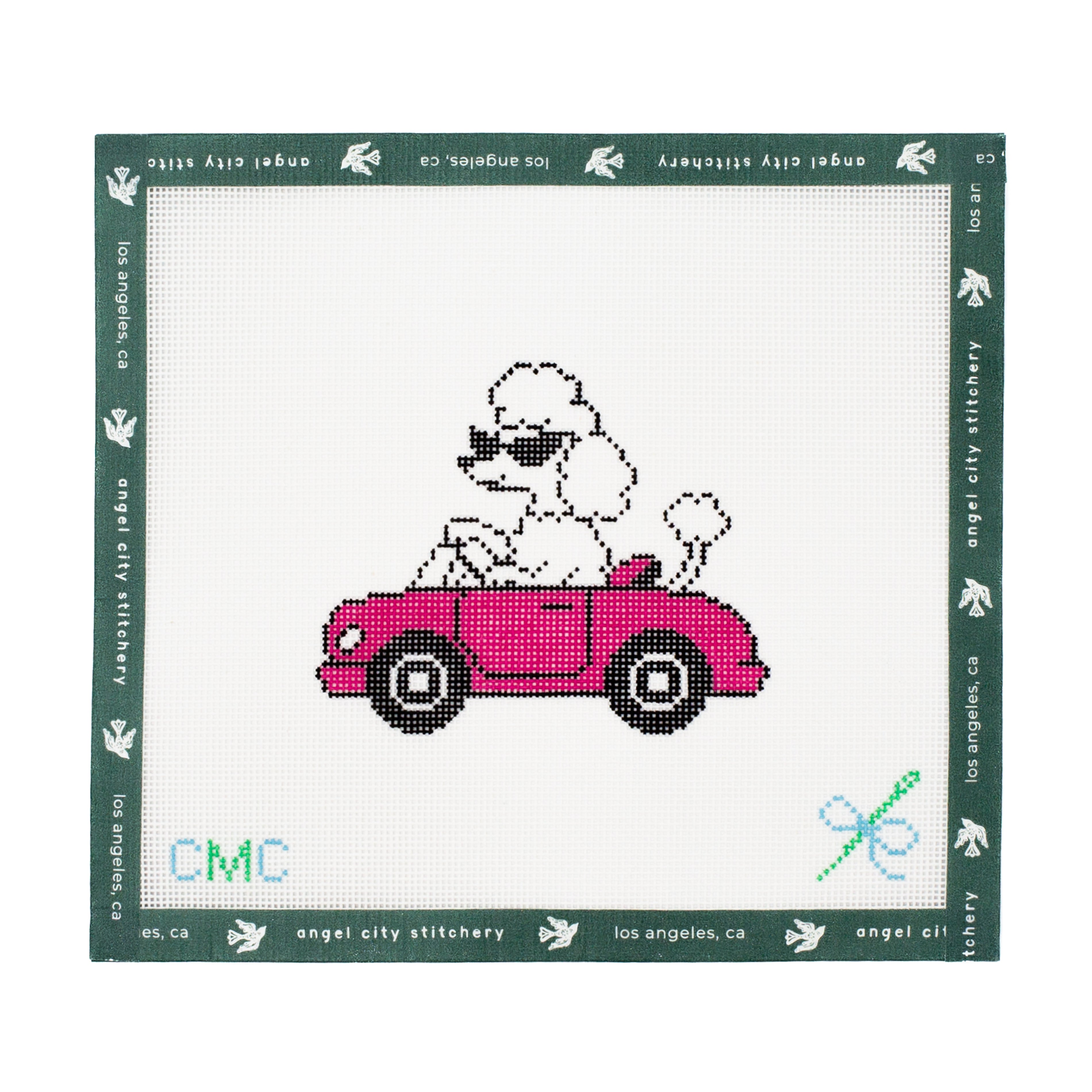Embroidery canvas design of a poodle in a pink car with 'CMC' branding on a white background.