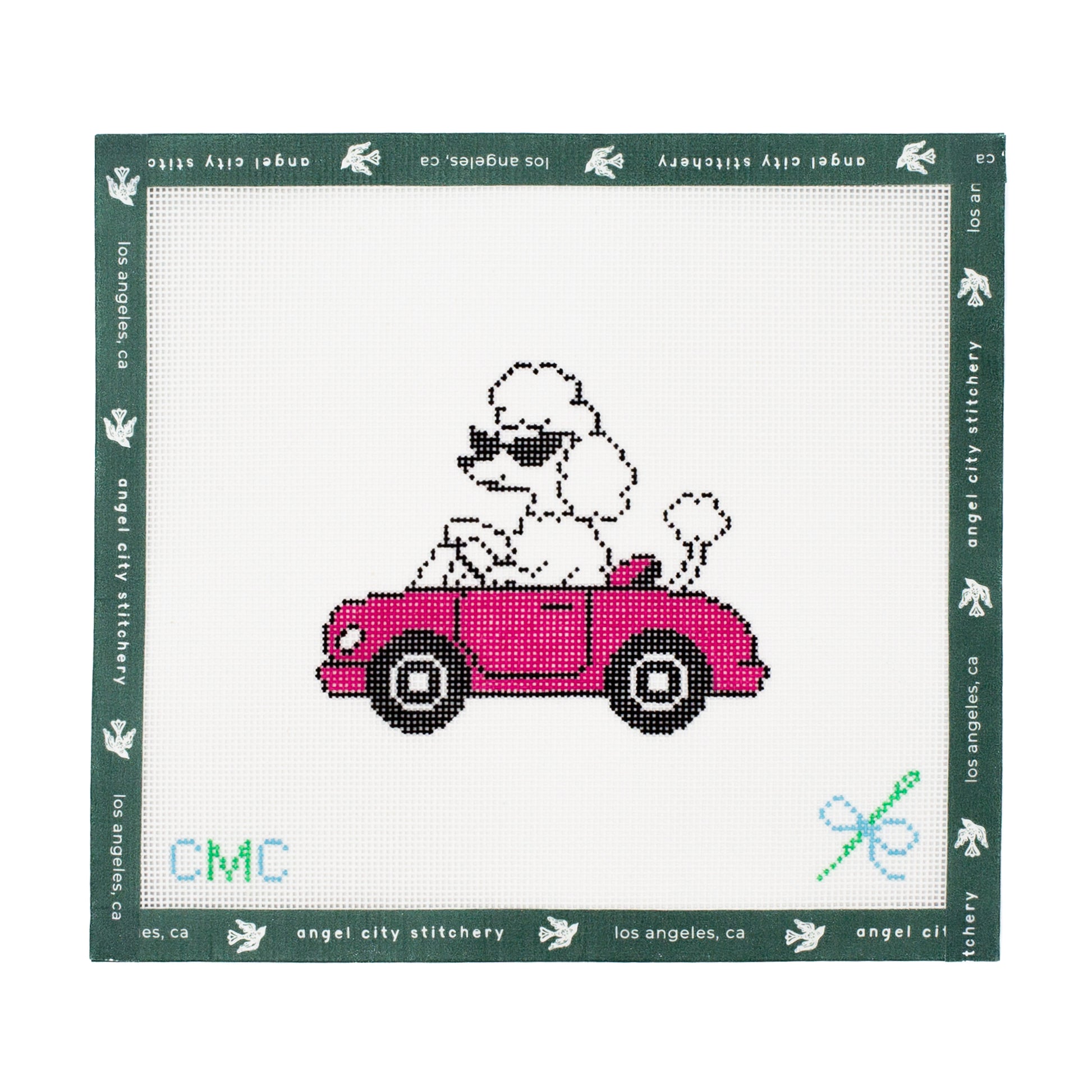 Embroidery canvas design of a poodle in a pink car with 'CMC' branding on a white background.