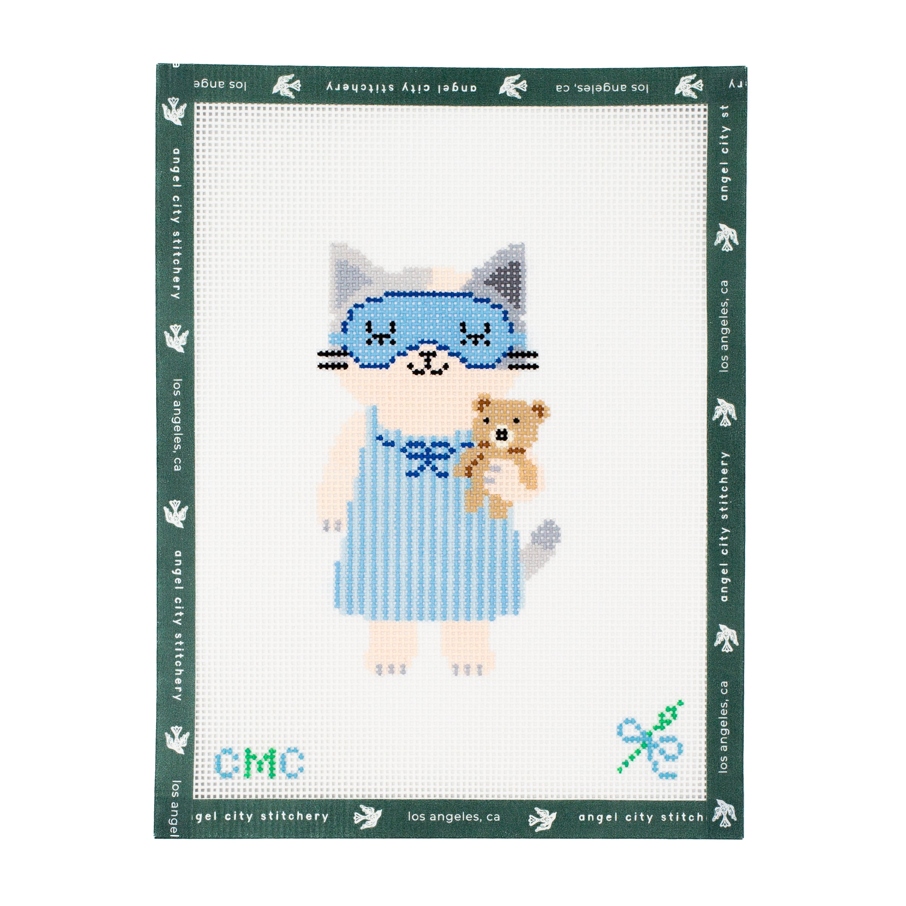 Embroidery canvas pattern of a cat character holding a teddy bear with 'Angel City Stitchery' branding.