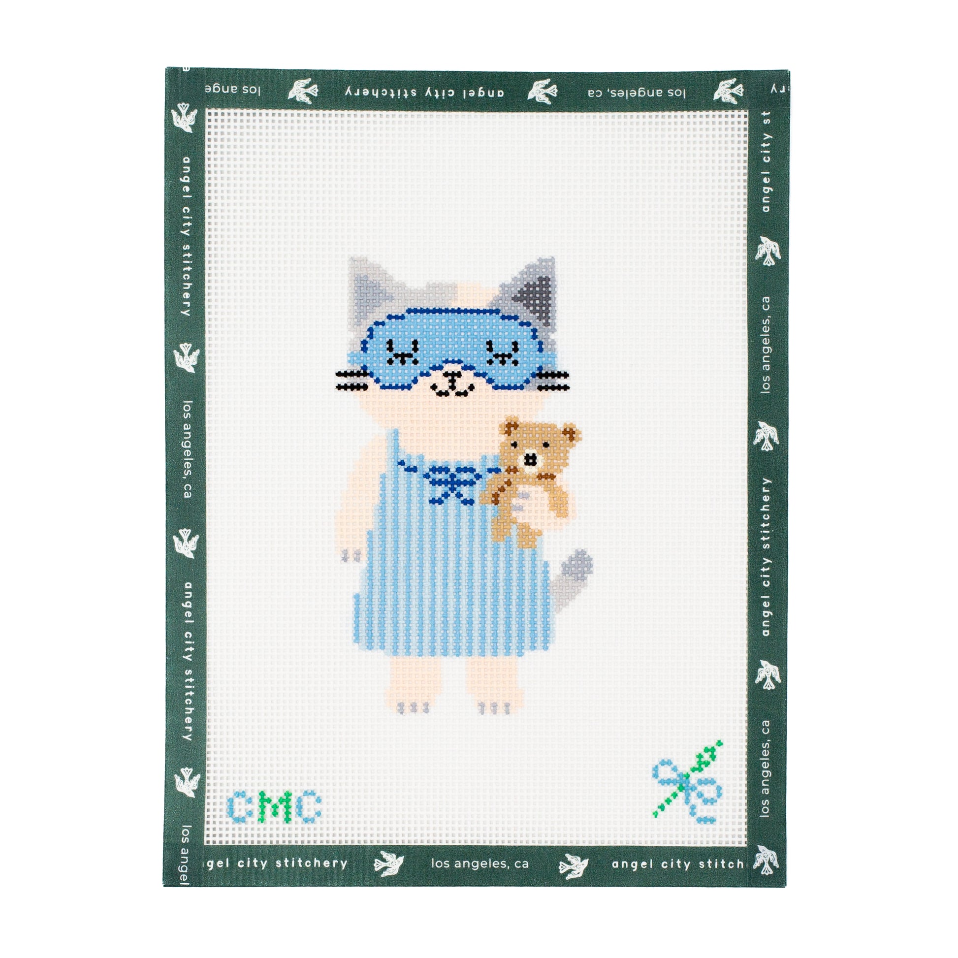 Embroidery canvas pattern of a cat character holding a teddy bear with 'Angel City Stitchery' branding.