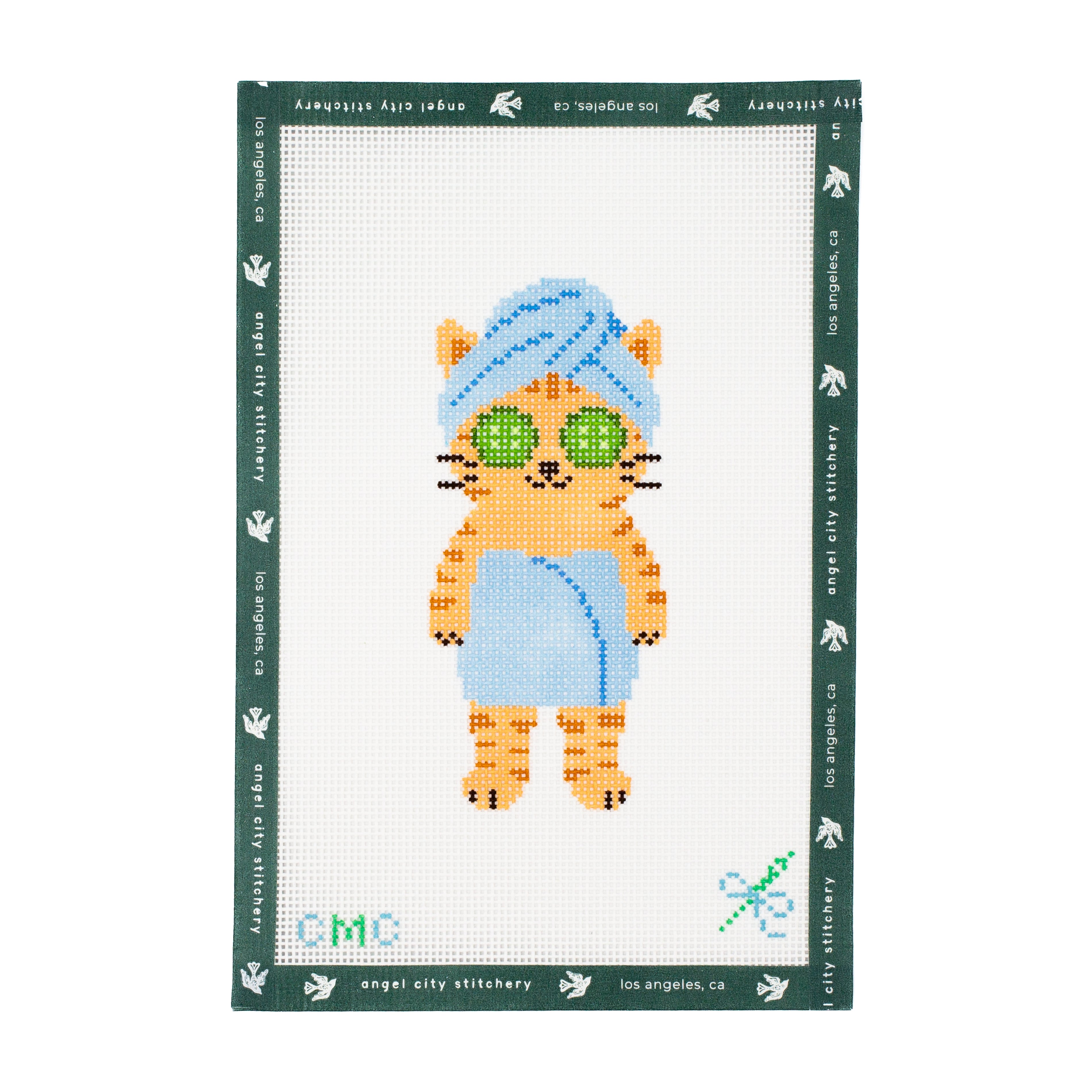 Embroidery canvas pattern of a cat character with cucumbers and a towel on a white background