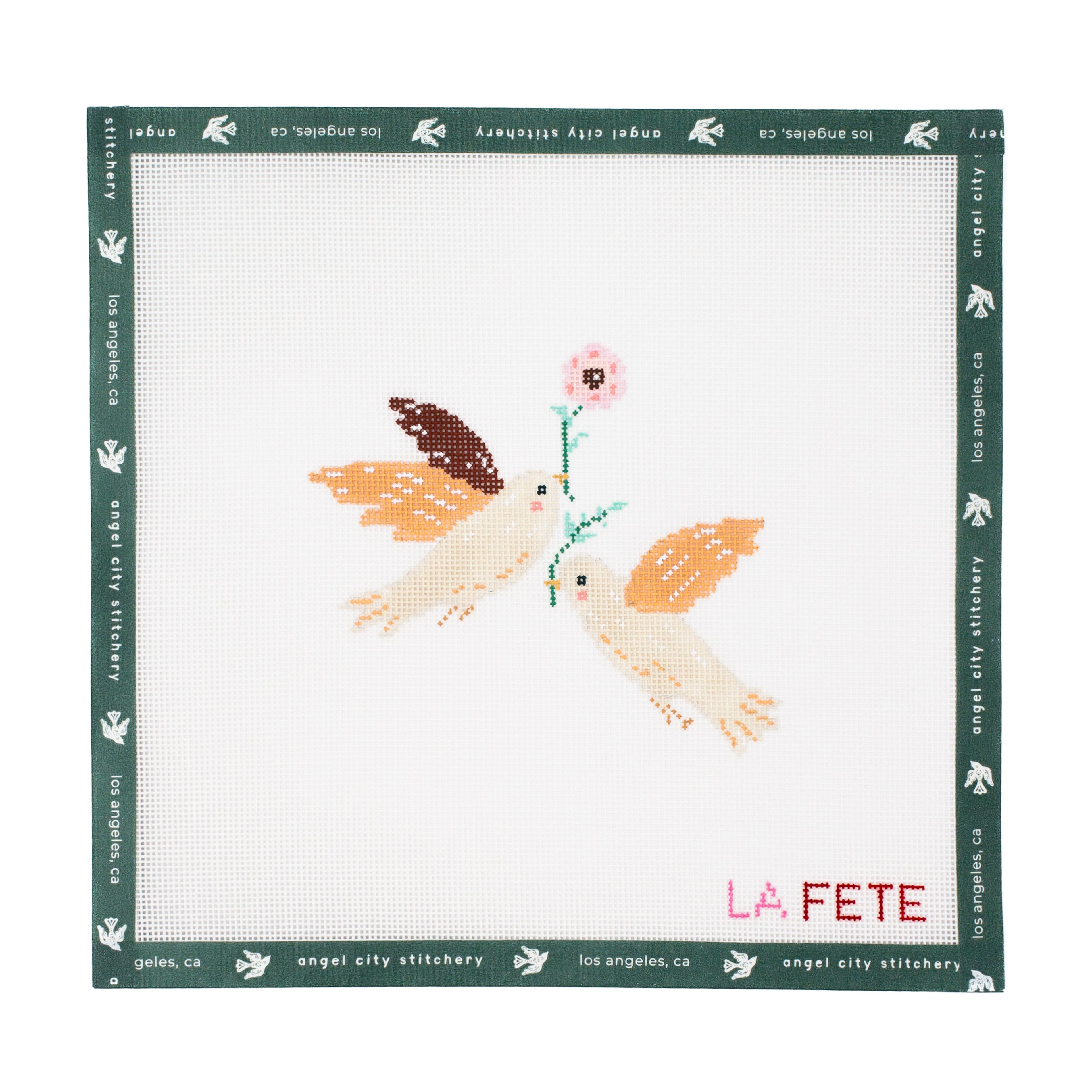 Embroidery canvas design of two birds with a flower on a white background, featuring 'La Fete' branding.