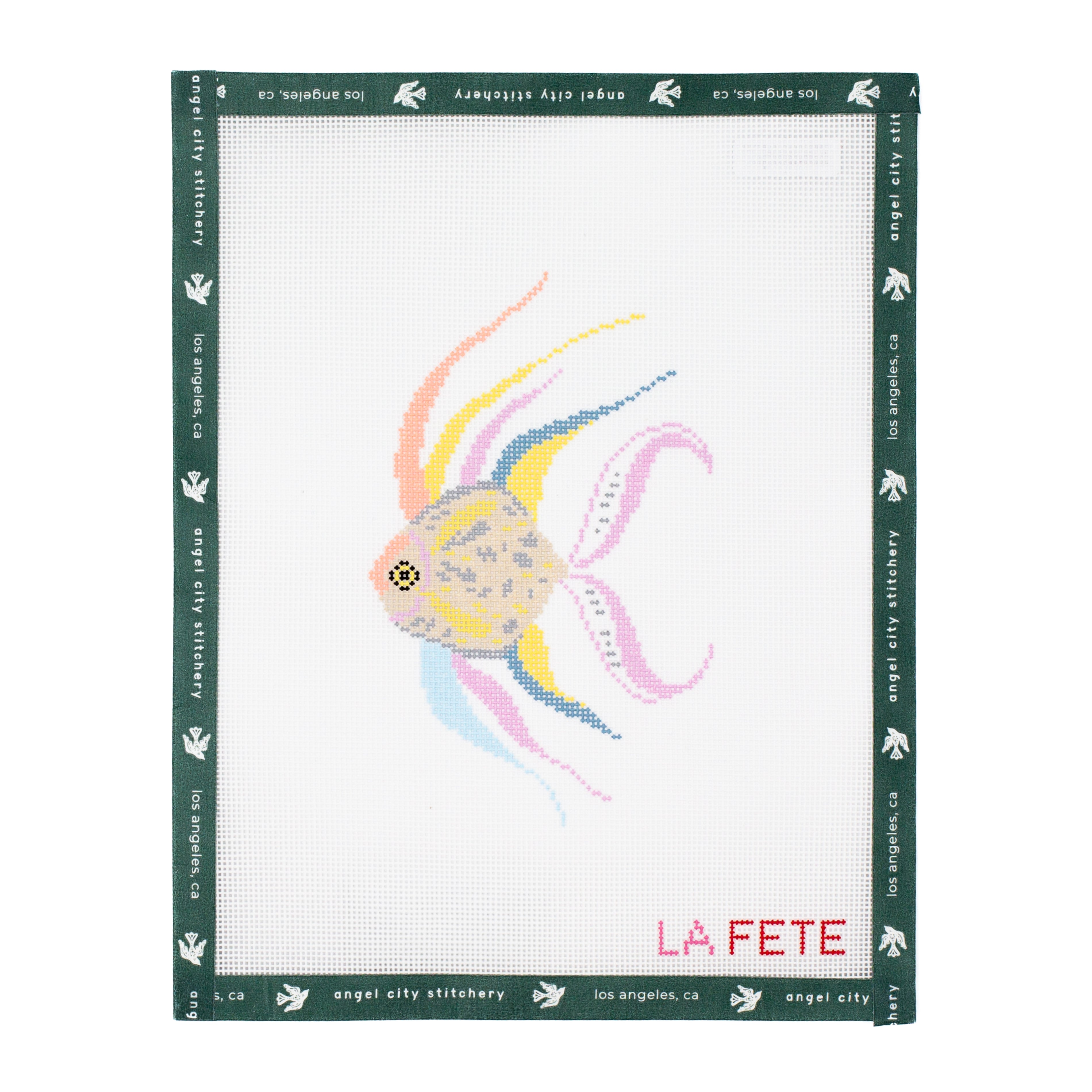 Needlepoint canvas pattern with a colorful fish design on a white background, featuring 'La Fete' branding.