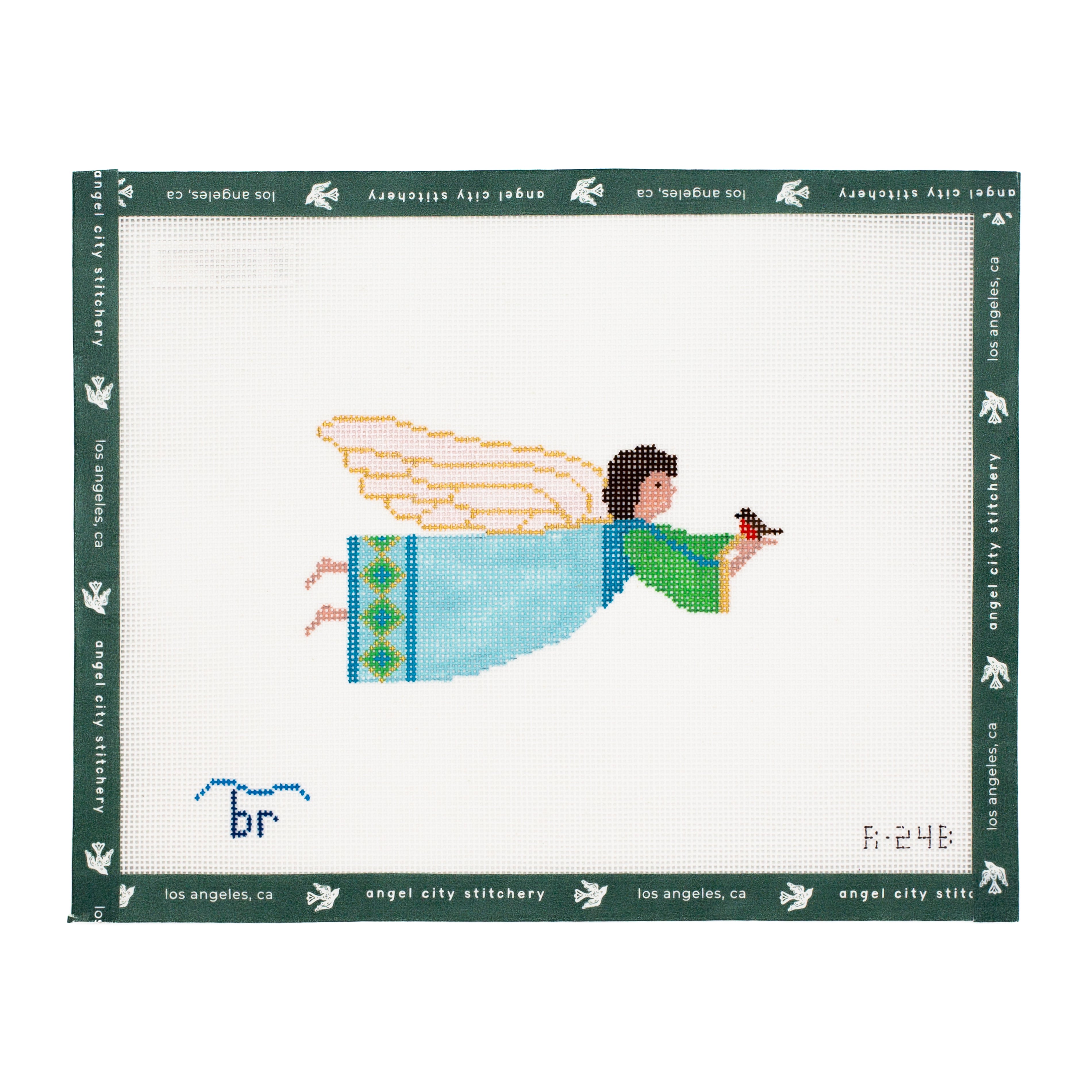 Cross-stitched angel design needlepoint canvas on with 'Angel City Stitchery' branding.