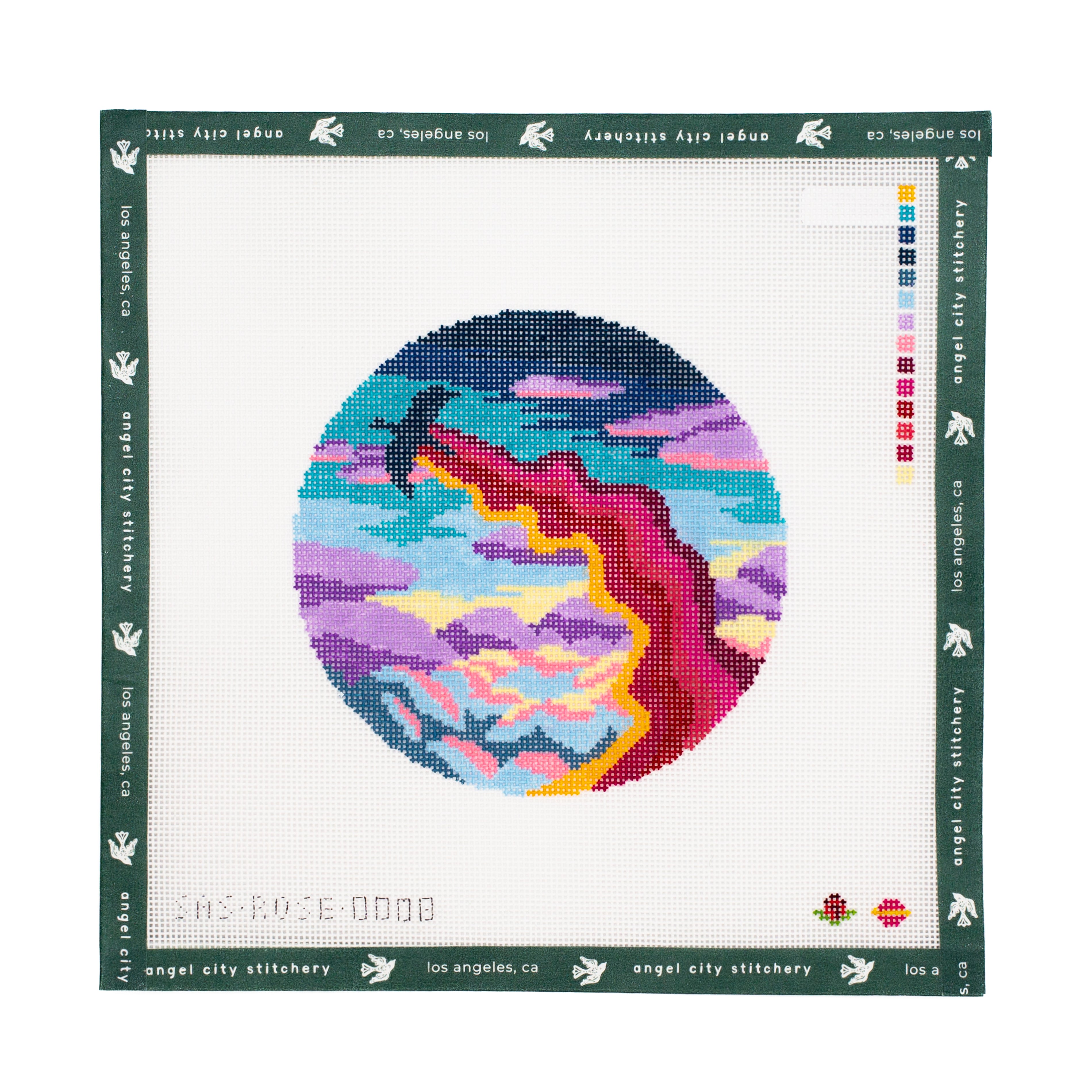 Needlepoint canvas  with colorful abstract design on a white fabric background