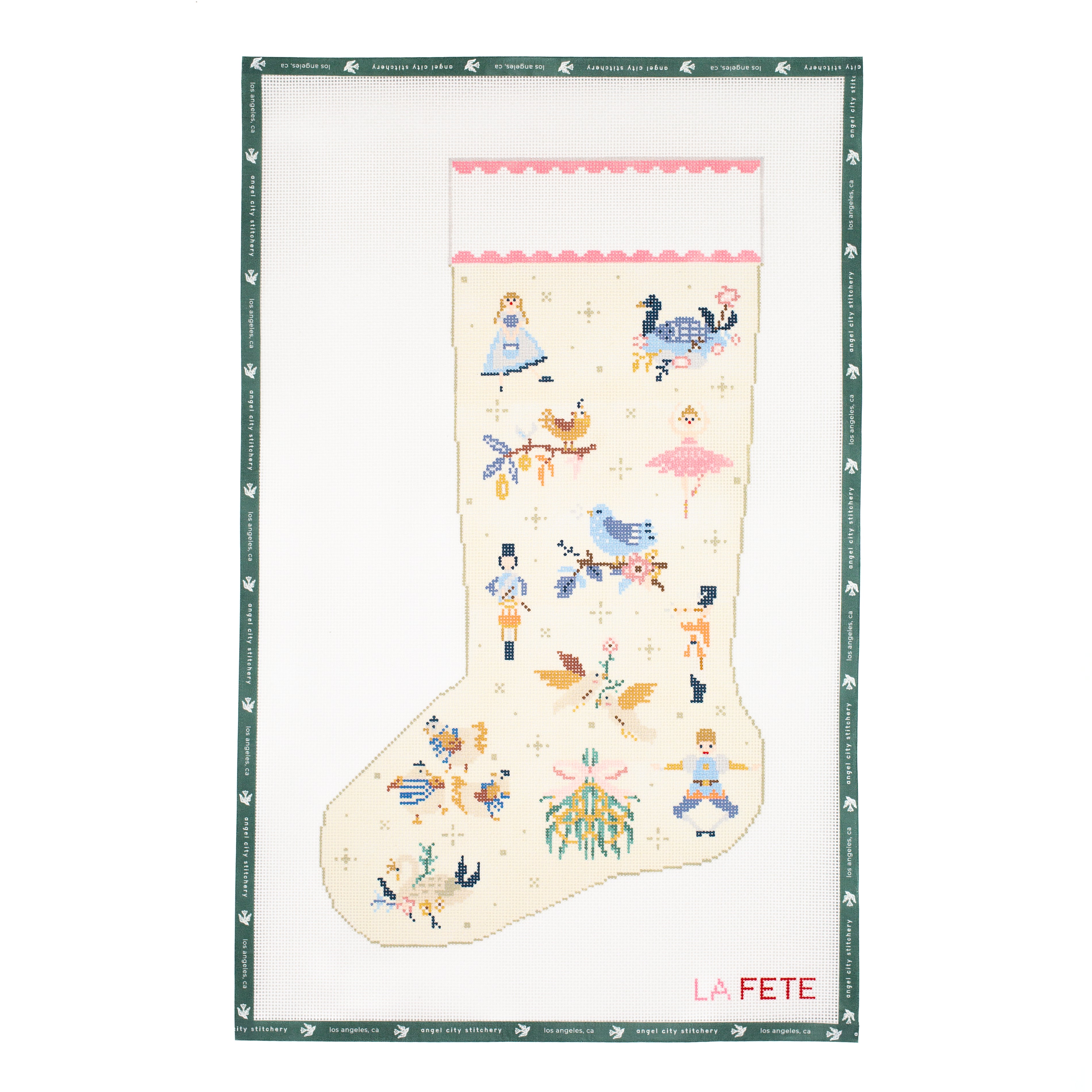 Needlepoint canvas of a decorative stocking with colorful designs on a white background, featuring the brand 'La Fete'.