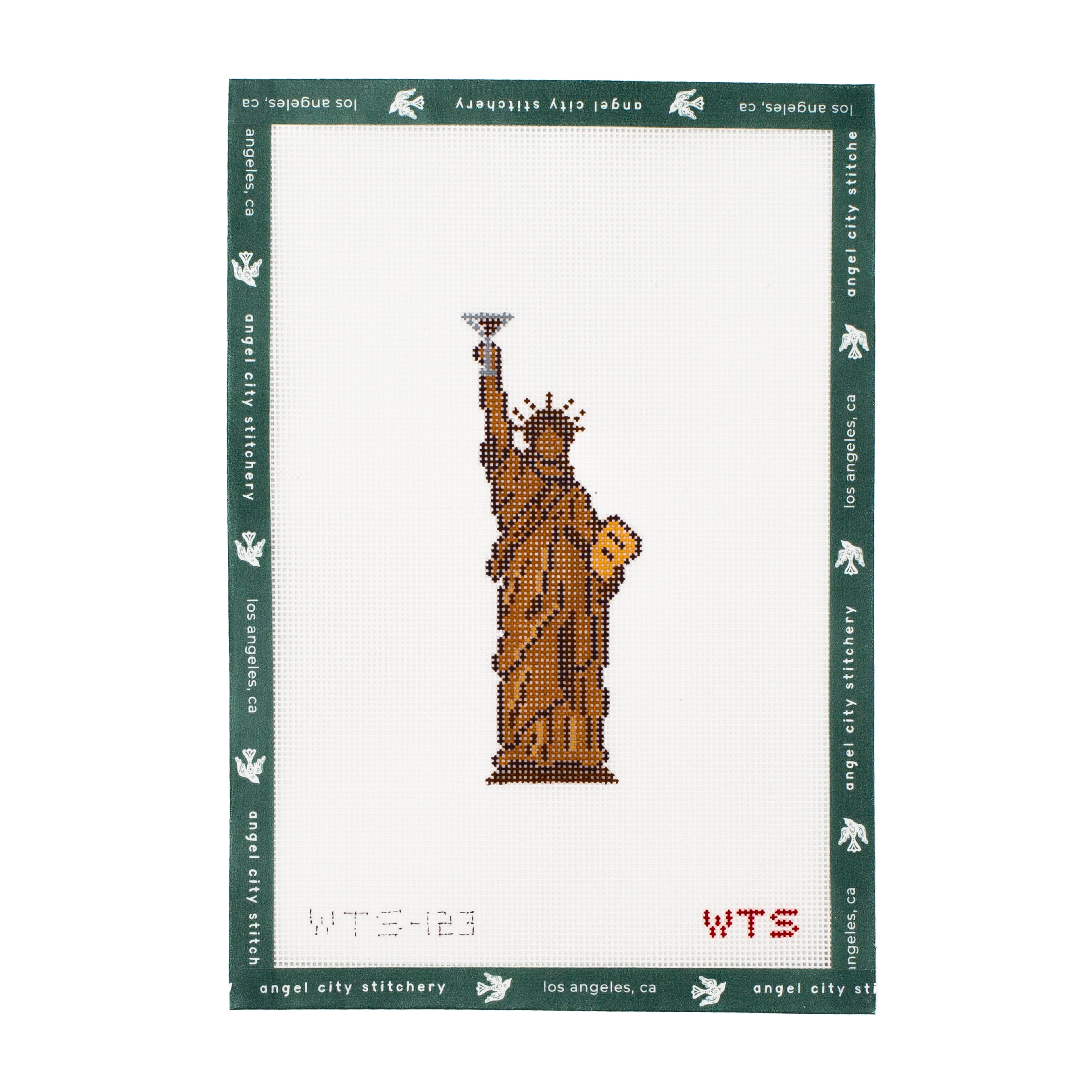 Embroidery canvas pattern of the Statue of Liberty on a white background with green border