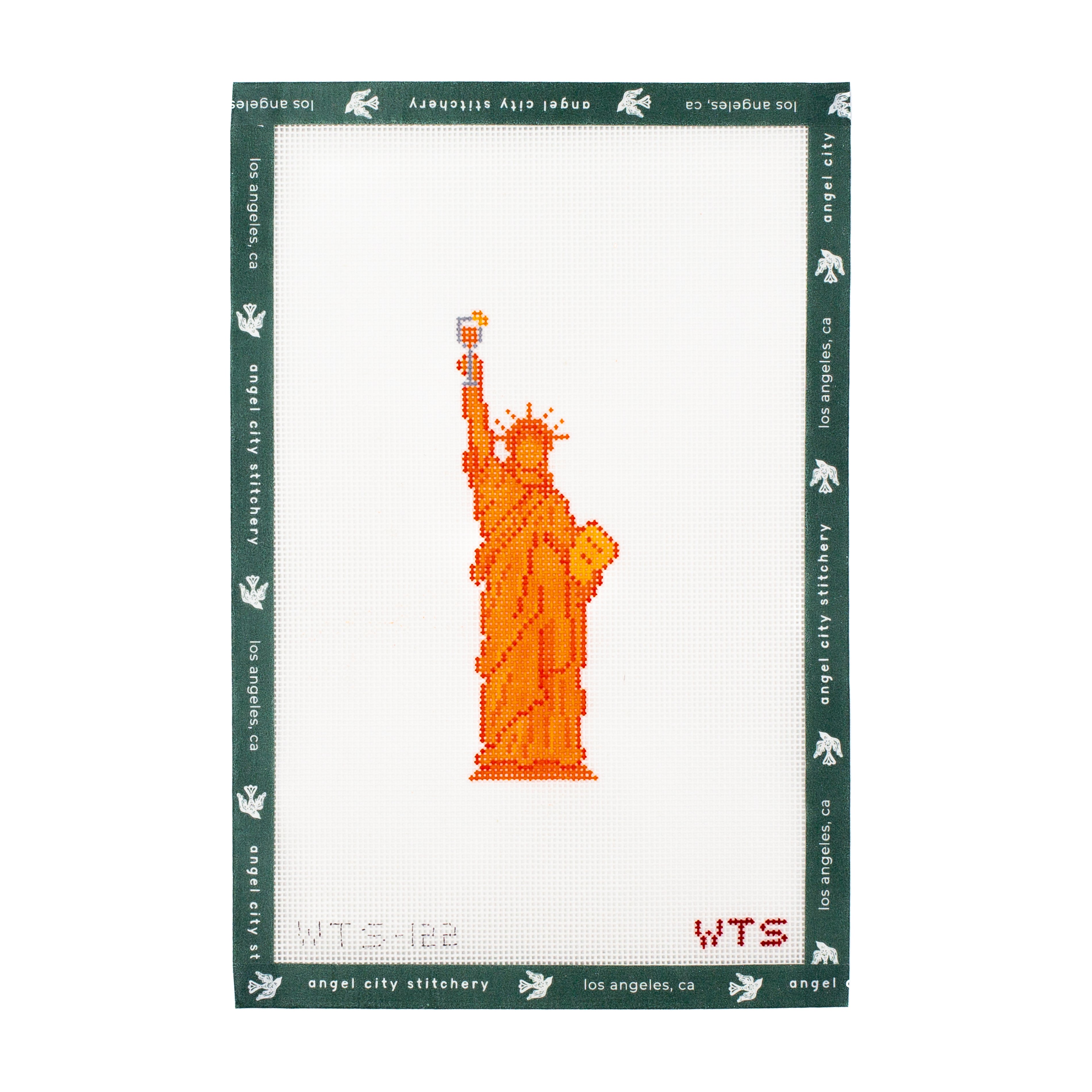 Embroidery canvas pattern of the orange Statue of Liberty on a white background with green border.