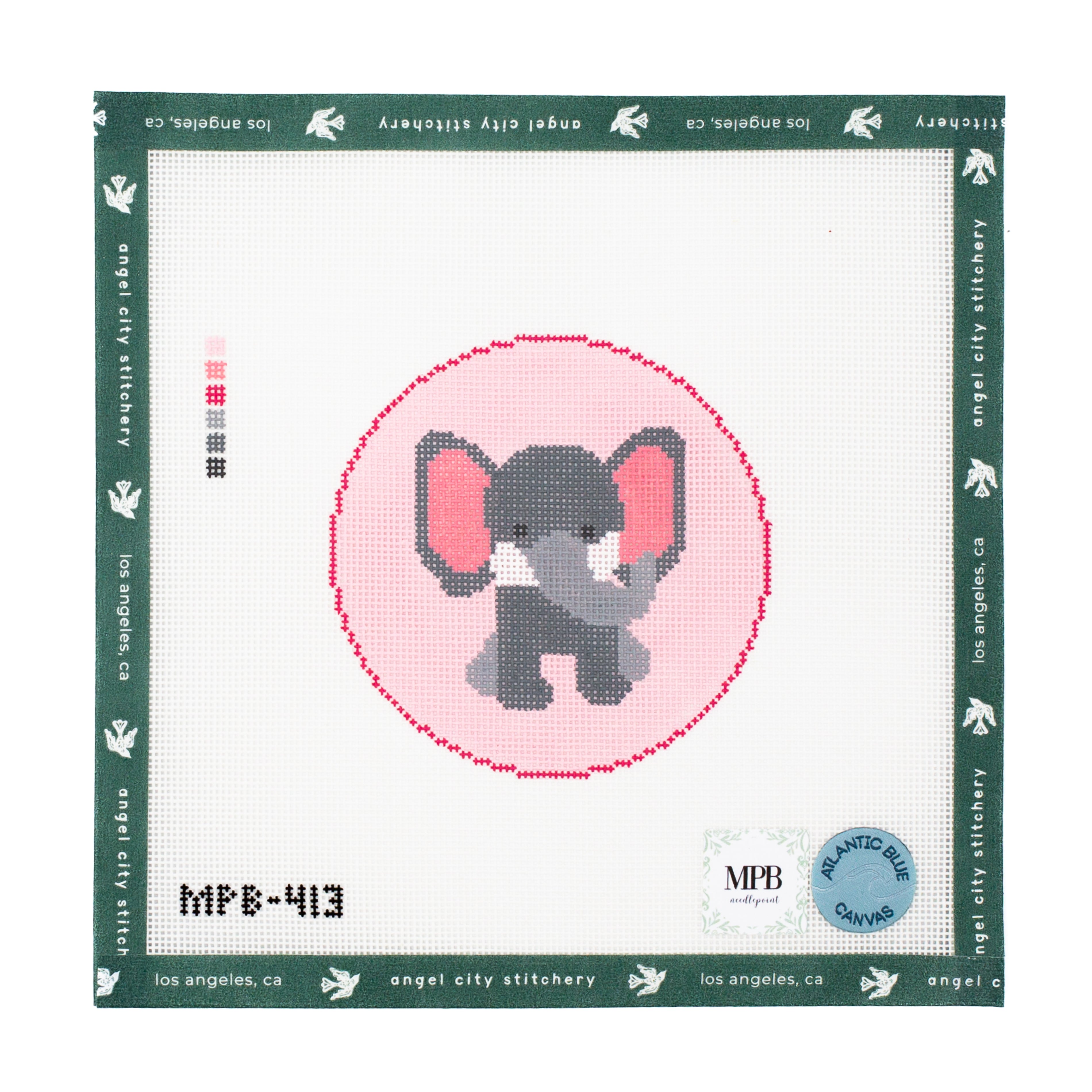 Needlepoint pattern with an elephant design on a white fabric background
