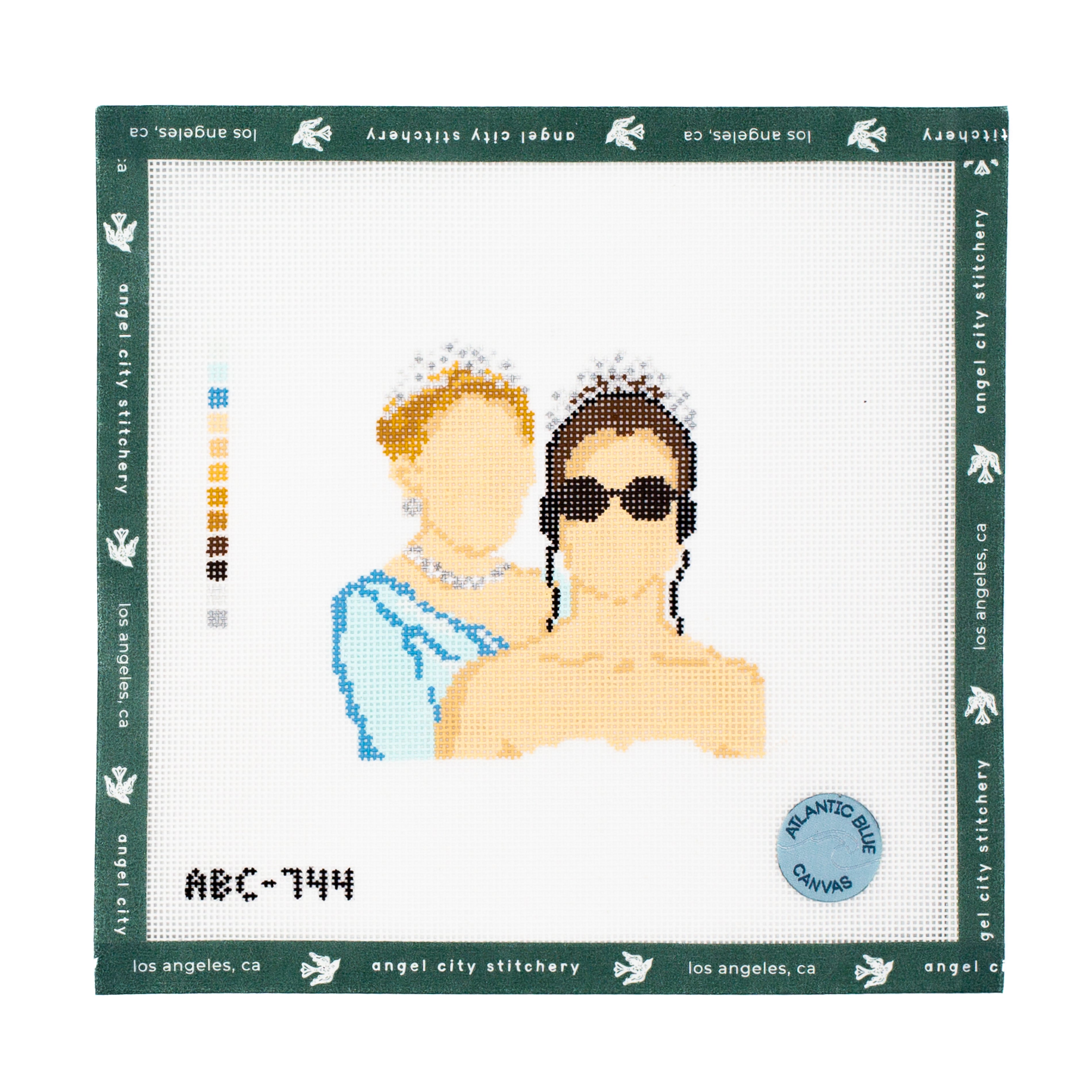 Needlepoint portrait of a queen and princess with text 'ABC-744' on a white background with green border.