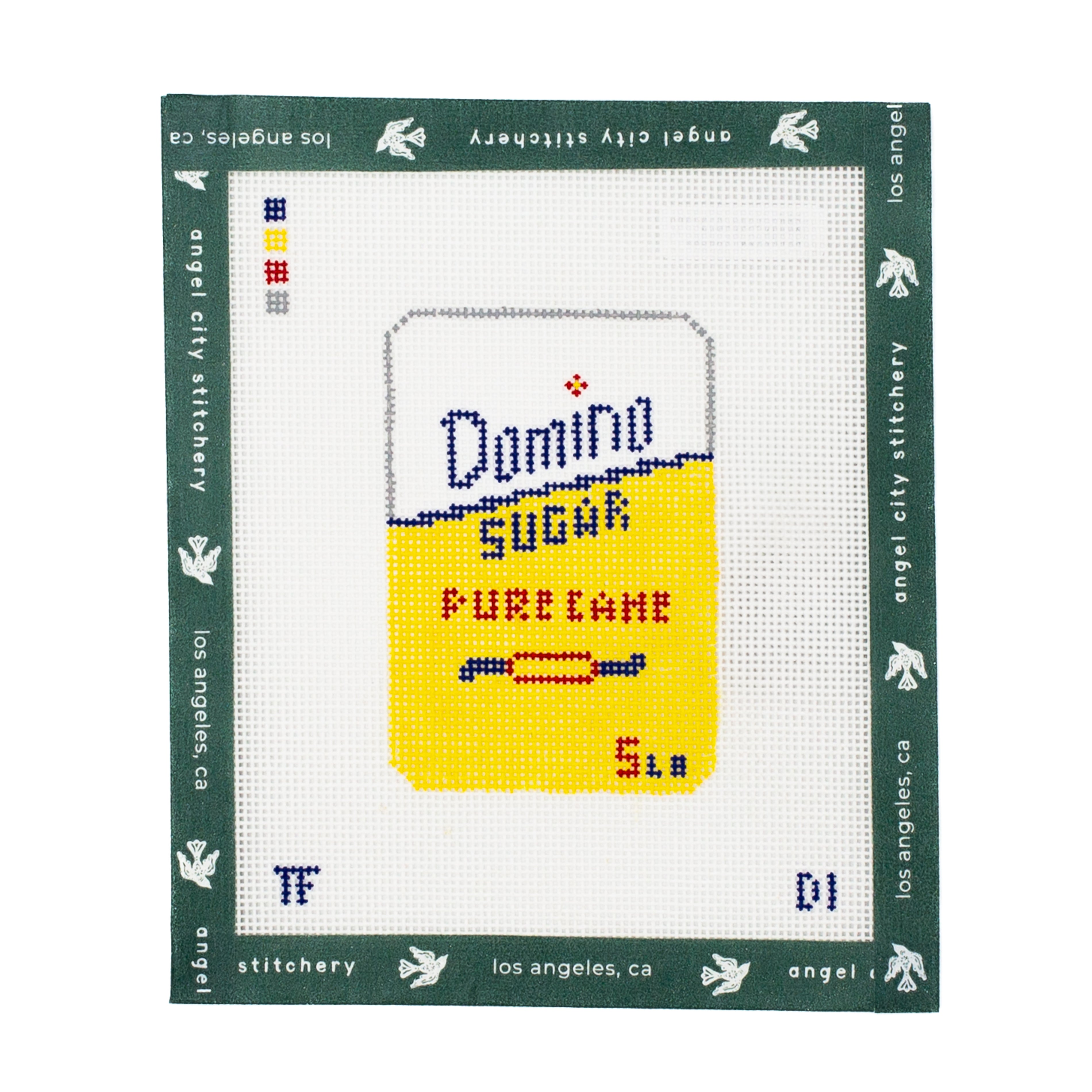 needlepoint canvas replica of a Domino Sugar packaging with 'Los Angeles, CA' text on a white background