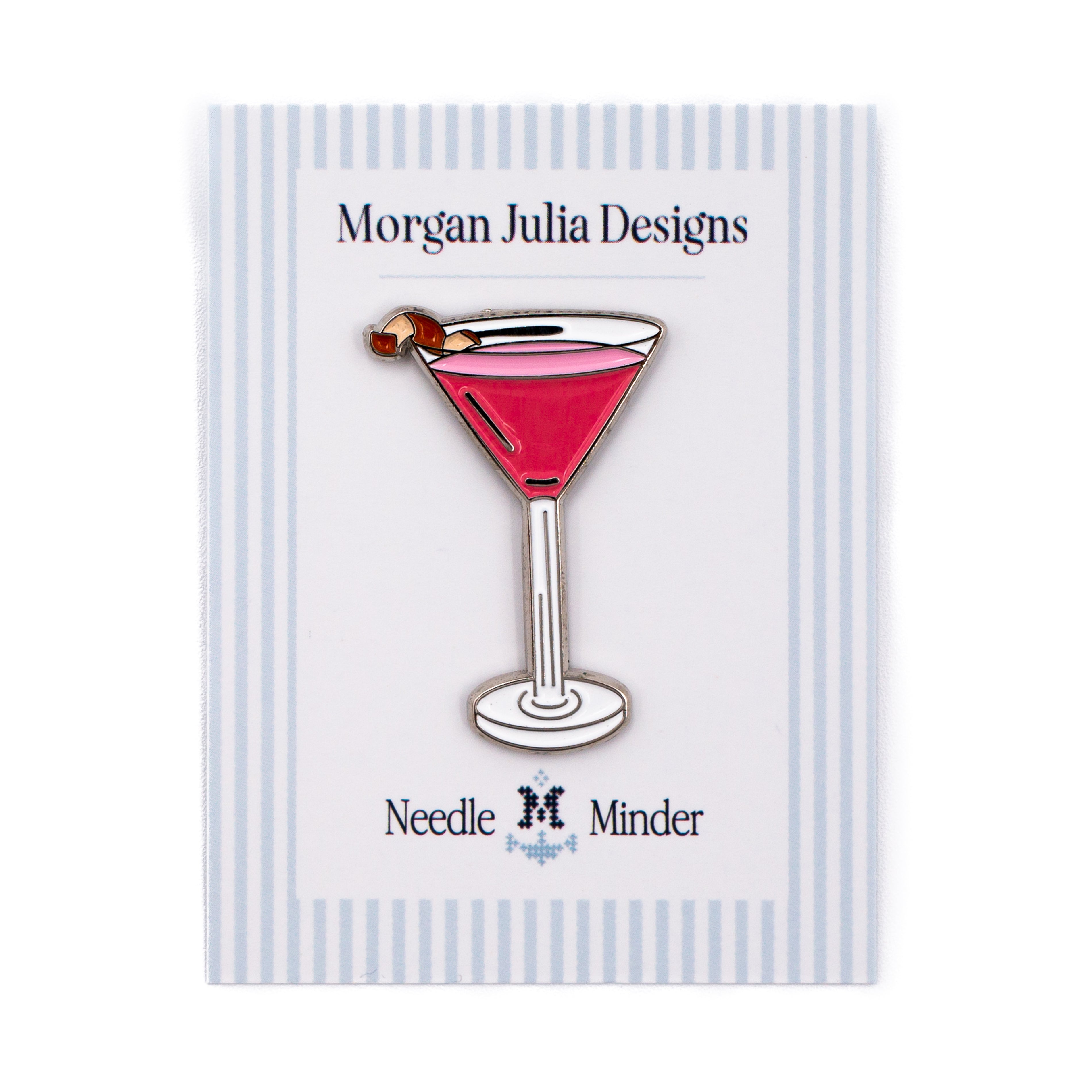 Pin of a pink cocktail glass with a cherry on a striped card by Morgan Julia Designs.