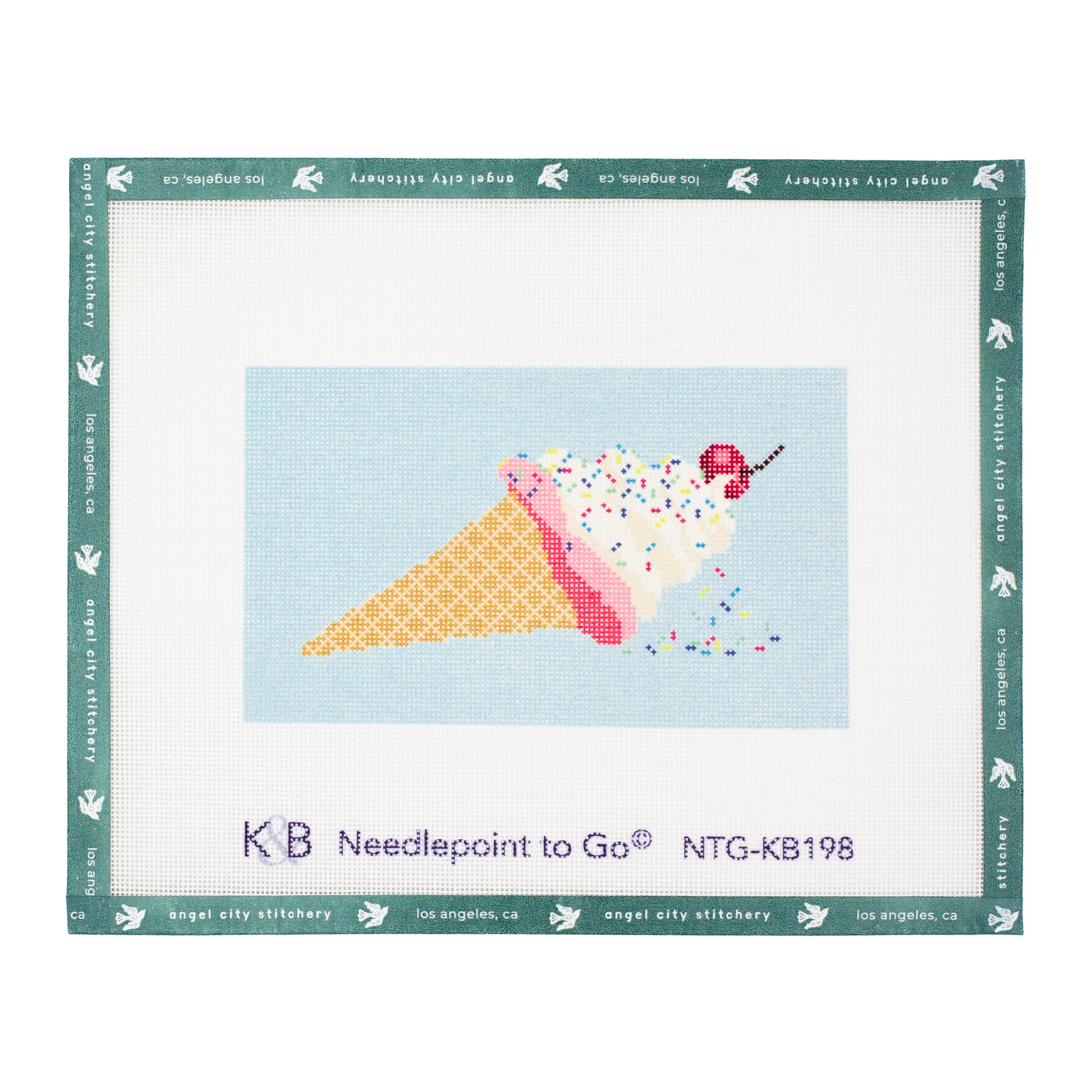Ice cream cone needlepoint canvas featuring a waffle cone, pink lining, white ice cream topped with colorful sprinkles and a cherry with a stem, set against a light blue background