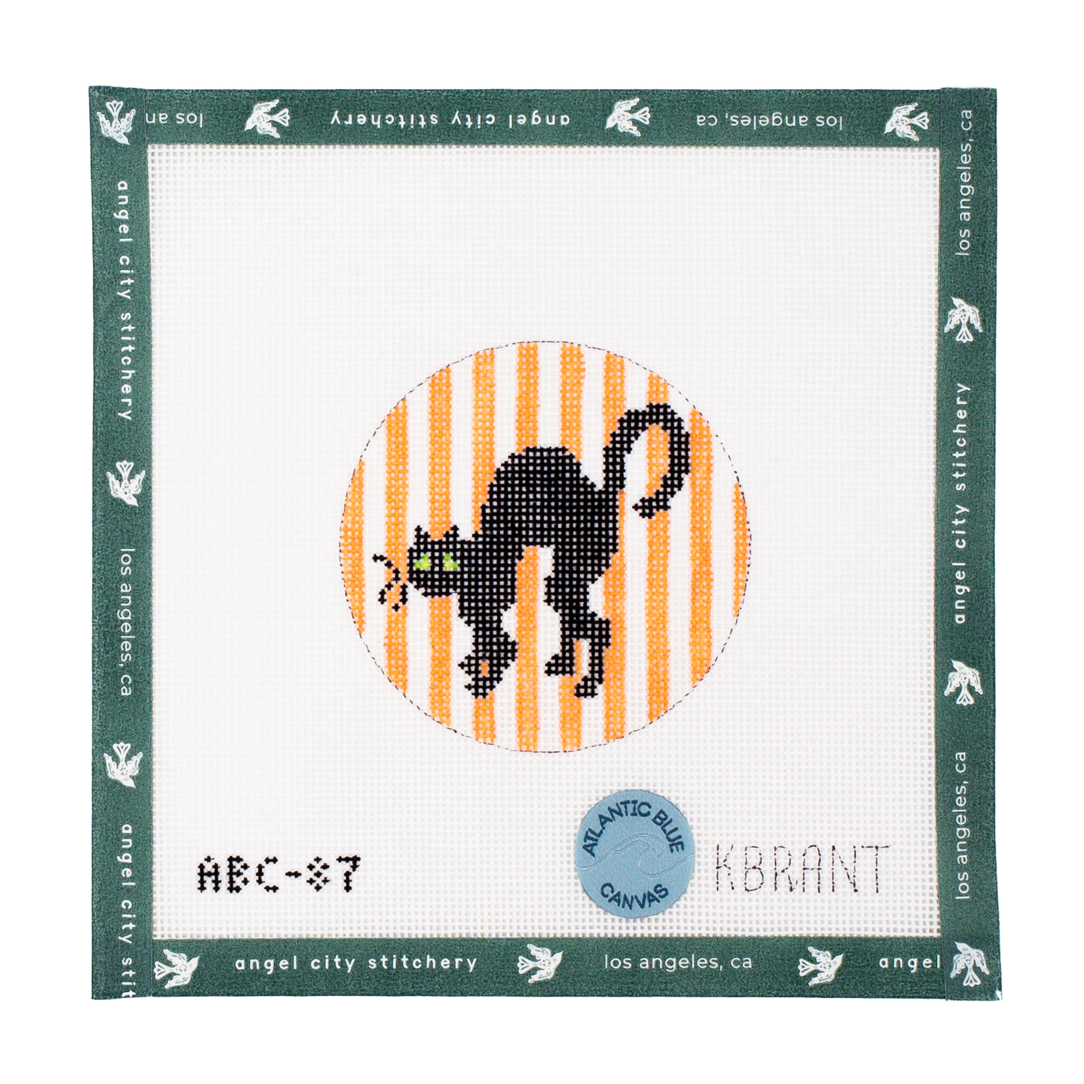 Black cat with green eyes on an orange striped background needlepoint canvas by Angel City Stitchery