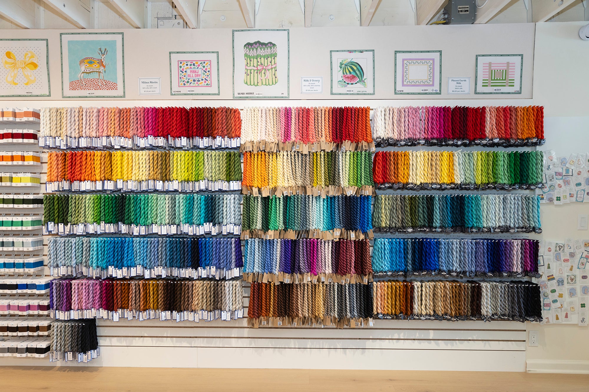 Display of colorful yarn spools in a store setting