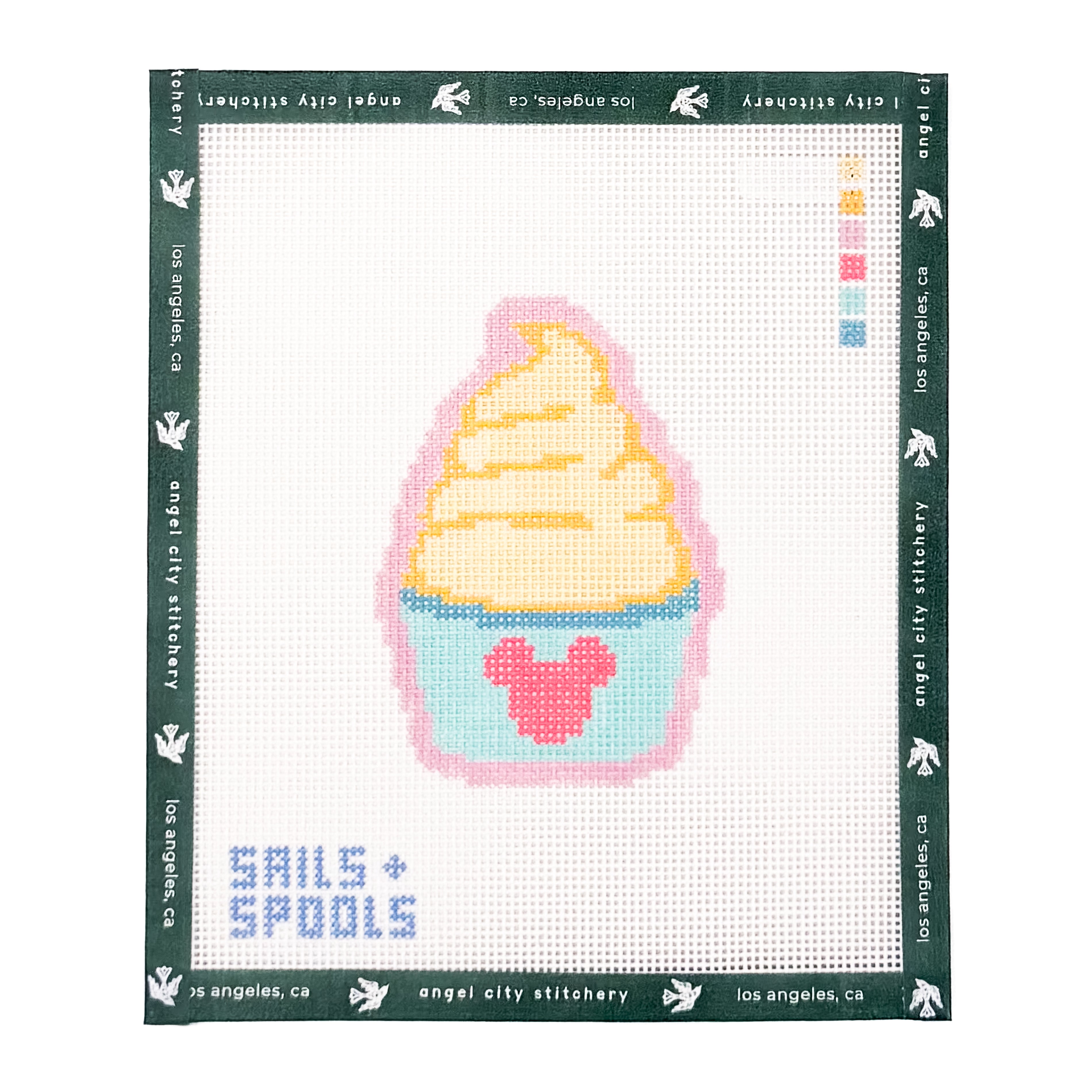 Dole Whip style soft serve in a light blue cup with a pink mouse silhouette needlepoint canvas by Angel City Stitchery