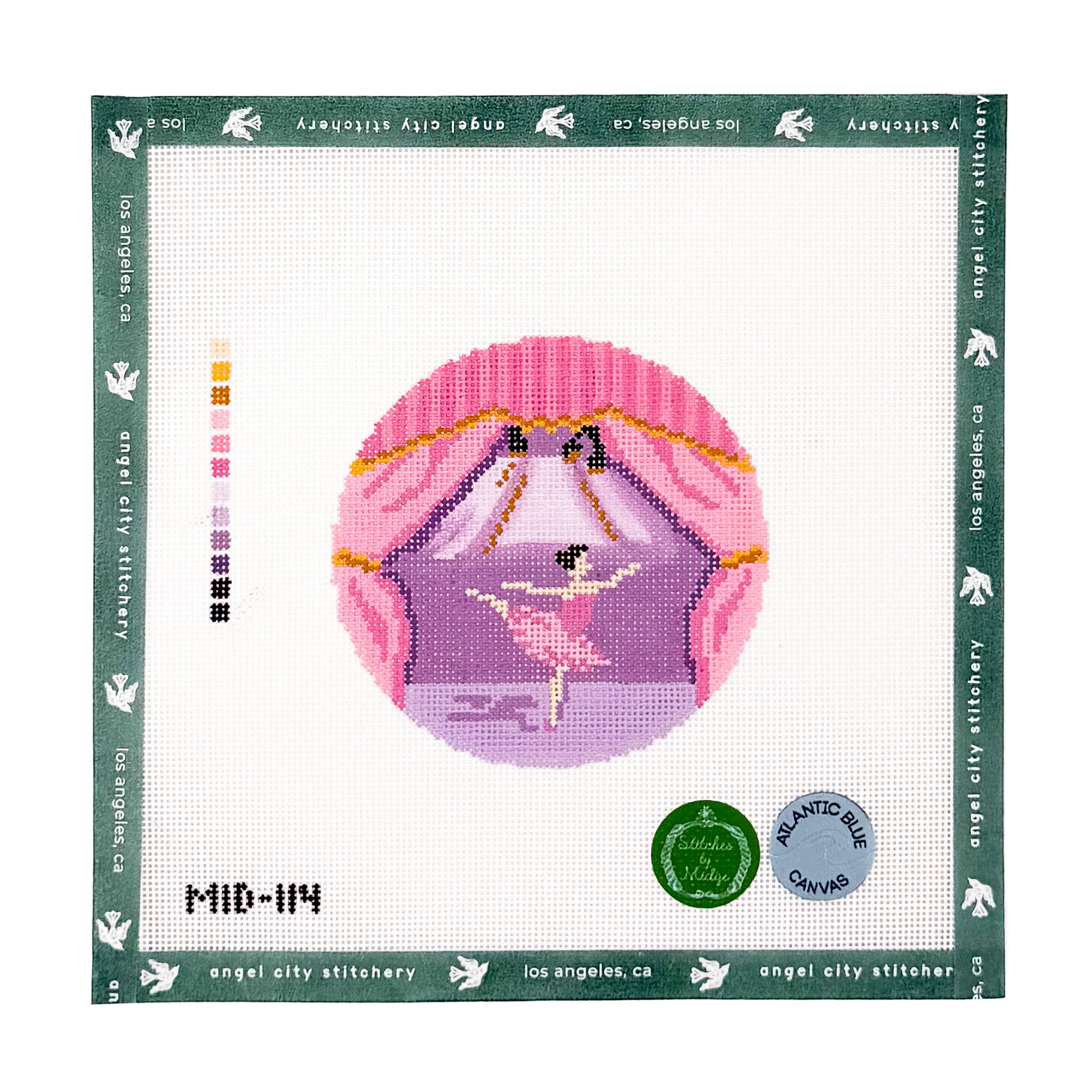 Circular needlepoint canvas featuring a ballerina dancing on a stage framed by pink stage curtains