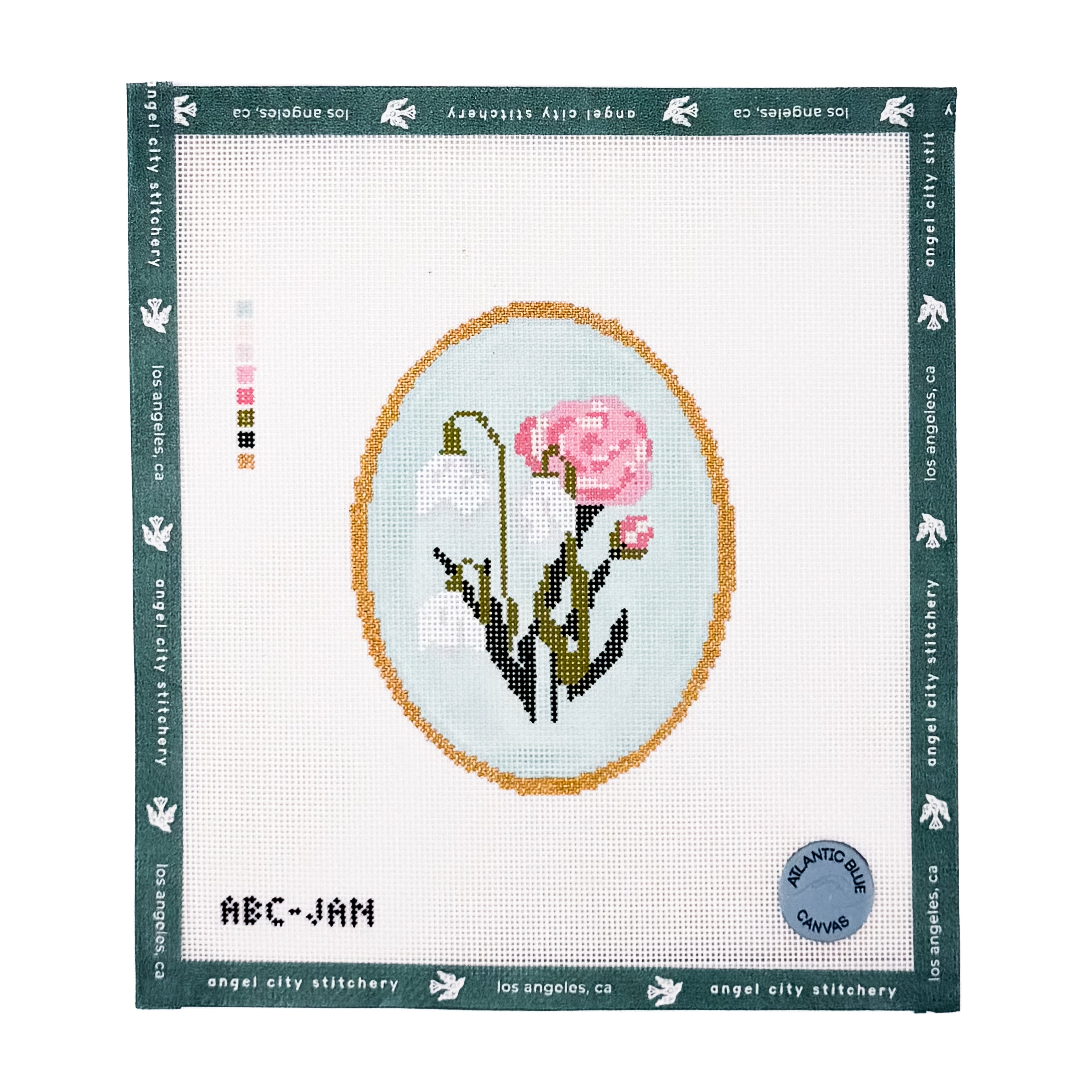 White and pink flowers inside an oval gold frame needlepoint canvas