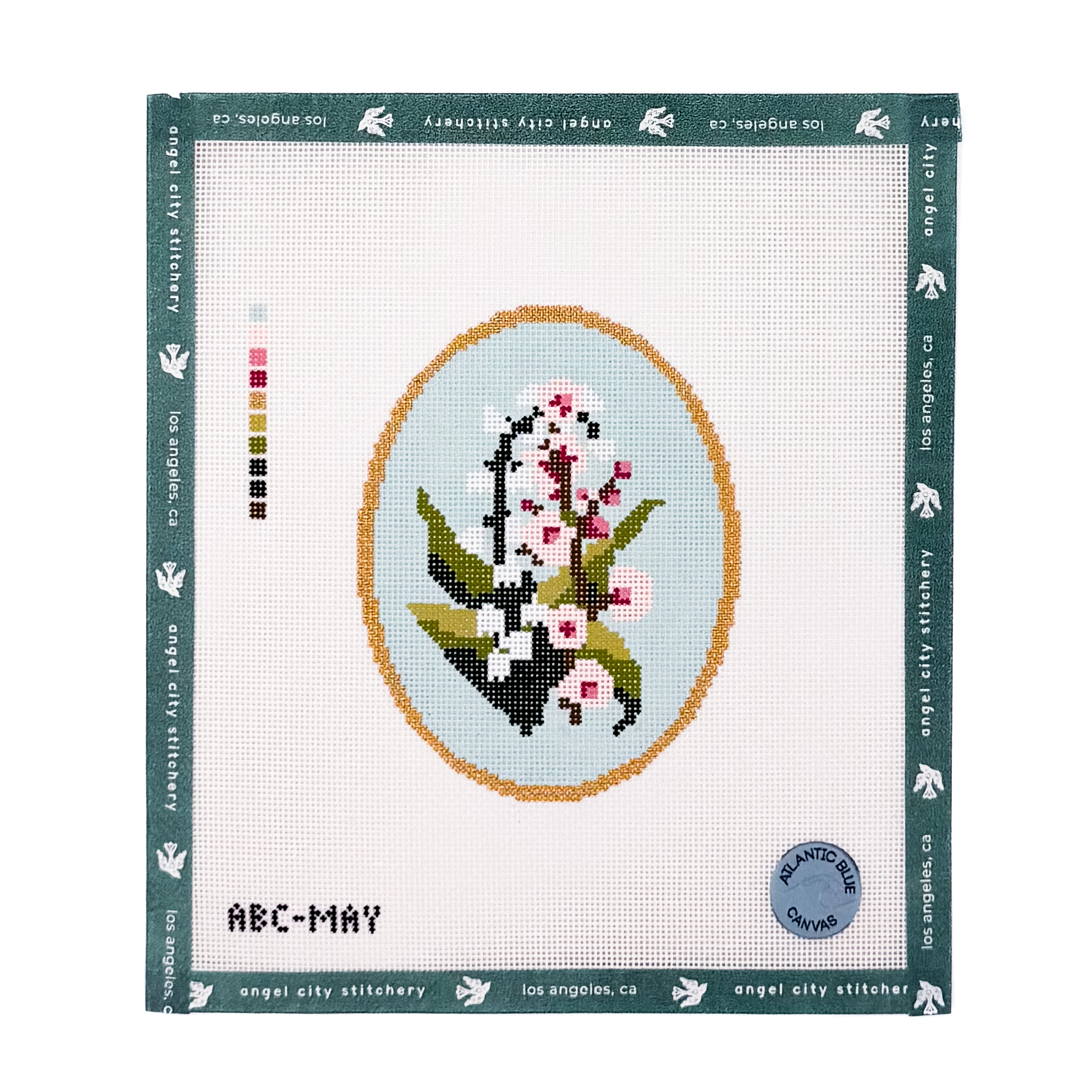 White and pink floral bouquet inside an oval gold frame needlepoint canvas