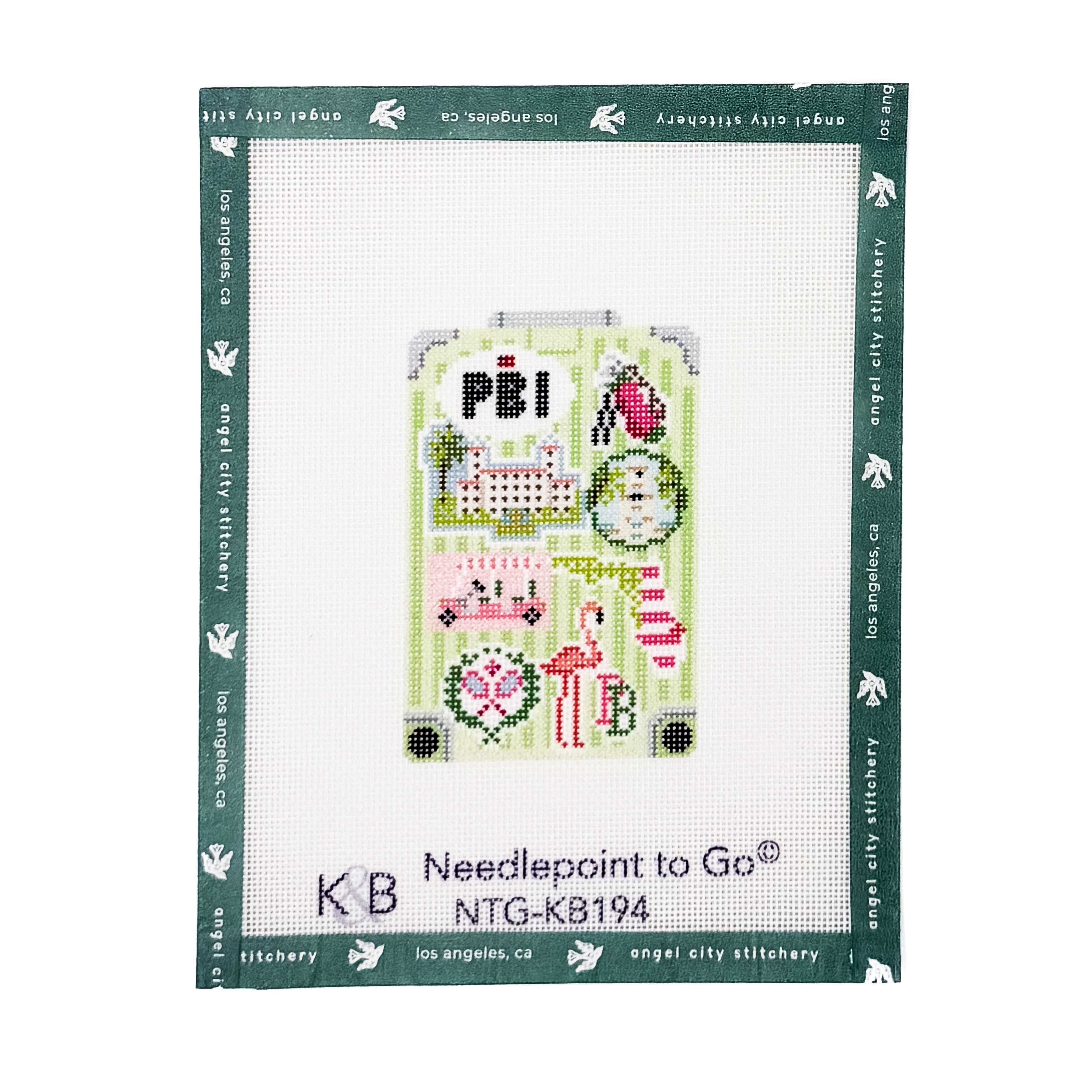 Needlepoint to Go NTG-KB194 cross-stitch canvas by Angel City Stitchery, featuring a light green suitcase design with pink flamingos, a red and white striped gift box, and a 'PBI' patch.