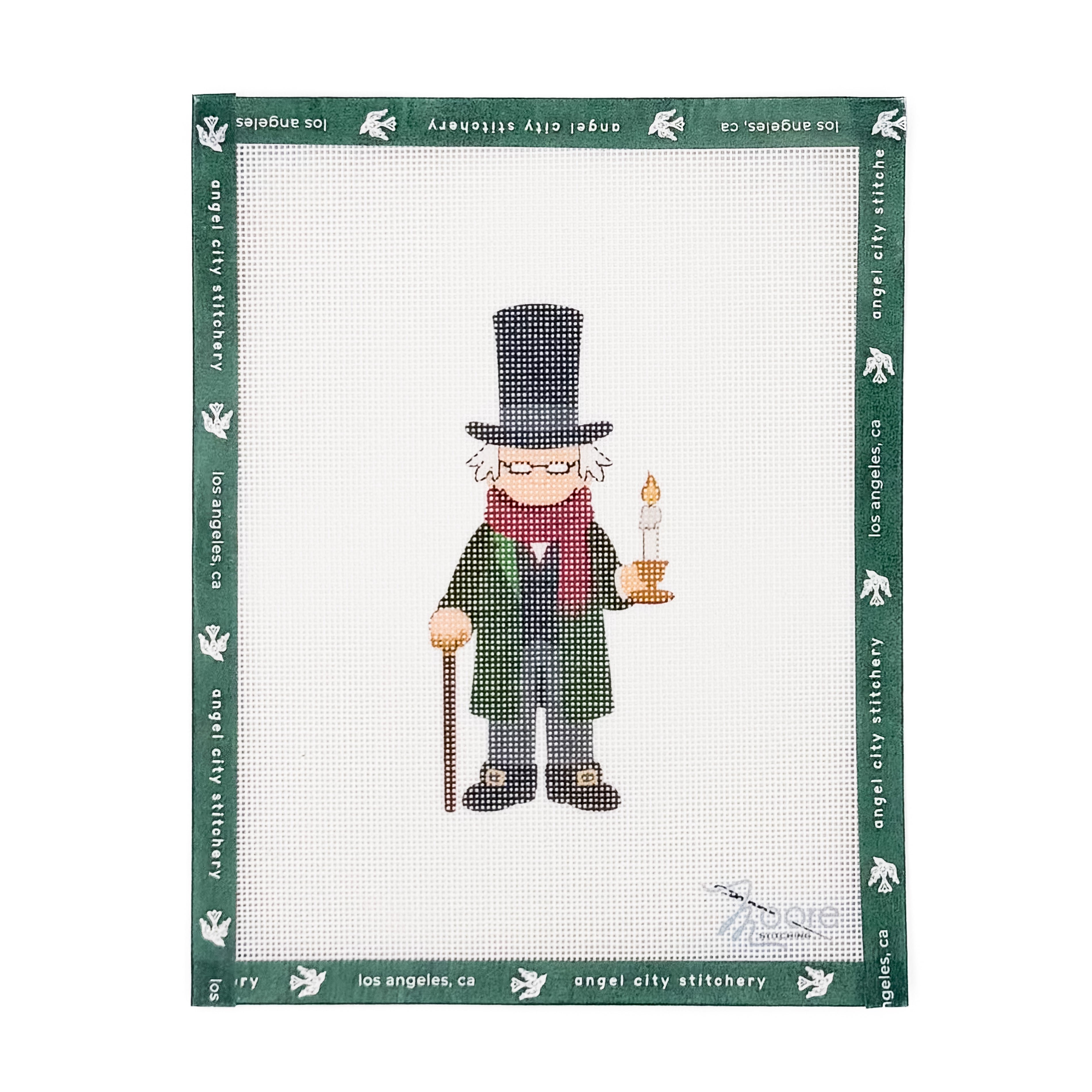 Ebenezer Scrooge character wearing a top hat, green coat, red scarf, and holding a cane and a lit candle needlepoint canvas by Angel City Stitchery