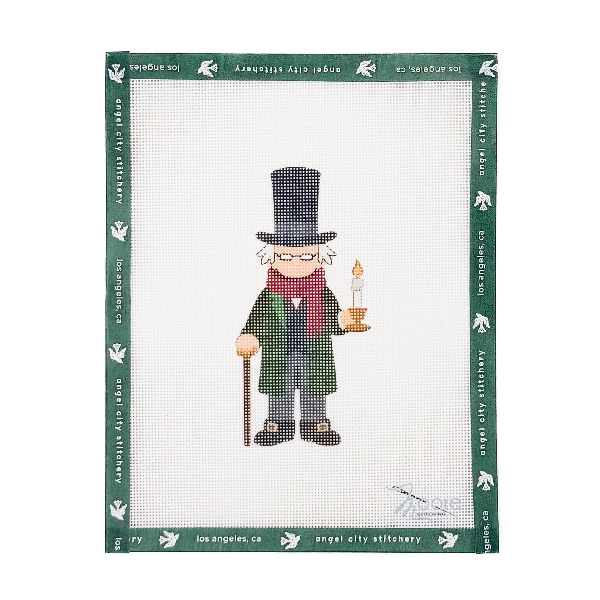 Ebenezer Scrooge character wearing a top hat, green coat, red scarf, and holding a cane and a lit candle needlepoint canvas by Angel City Stitchery